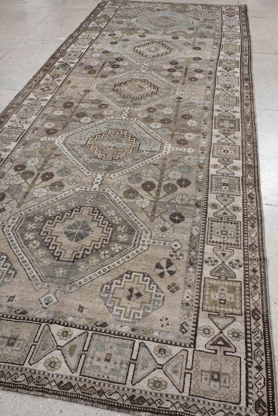 5' x 14' one-of-a-kind handmade antique Shiraz rug. Color palette: taupe, ivory, brown, slate, camel, charcoal, sage, beige