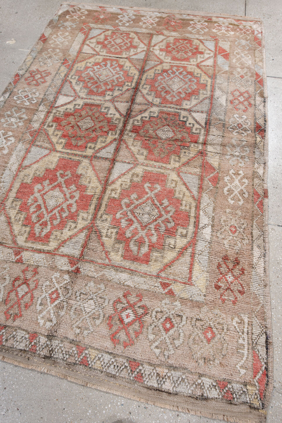 4' x 7' one-of-a-kind handmade vintage Anatol rug. Color palette: brown, gray, light gray, off-white, pink, red, silver