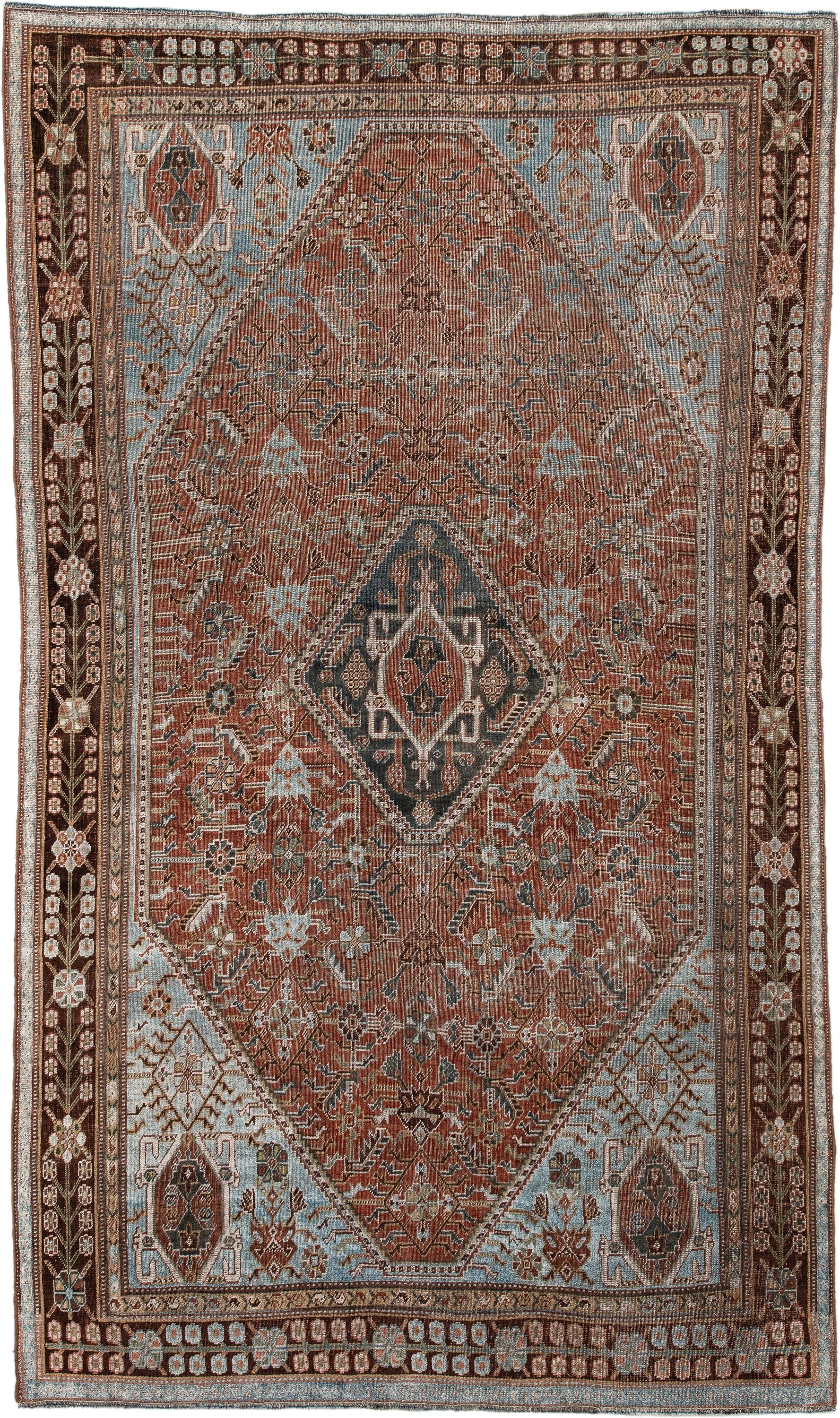 4' x 7' one-of-a-kind handmade vintage Qashqai rug. Color palette: terra cotta, pale blue, ivory, dark brown, slate, taupe