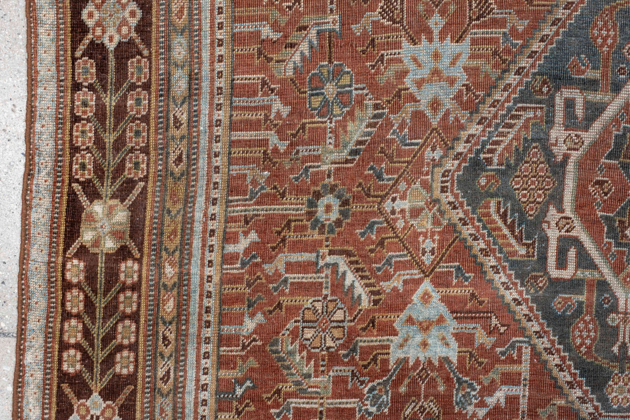 4' x 7' one-of-a-kind handmade vintage Qashqai rug. Color palette: terra cotta, pale blue, ivory, dark brown, slate, taupe