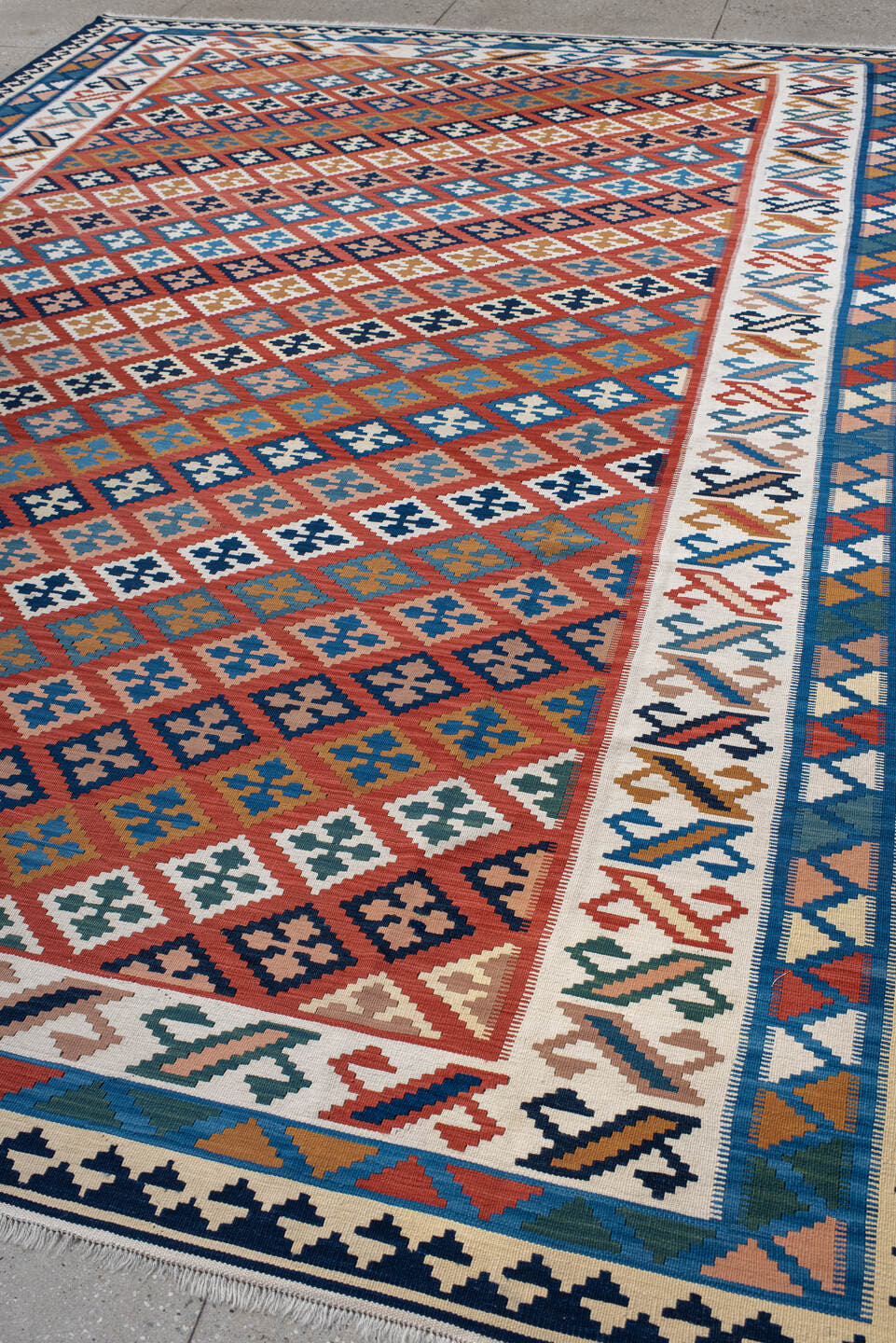 9' x 13' one-of-a-kind handmade vintage Kilim large size rug. Color palette: terracotta, ivory, navy, sky_blue, gold, teal