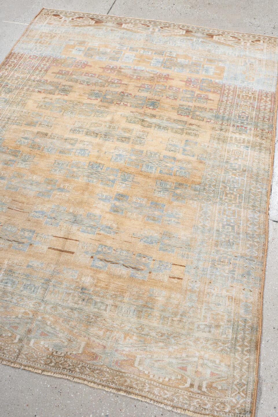 4' x 5' one-of-a-kind handmade antique Yamoud small size rug. Color palette: ivory, pale blue, camel, soft rust, taupe