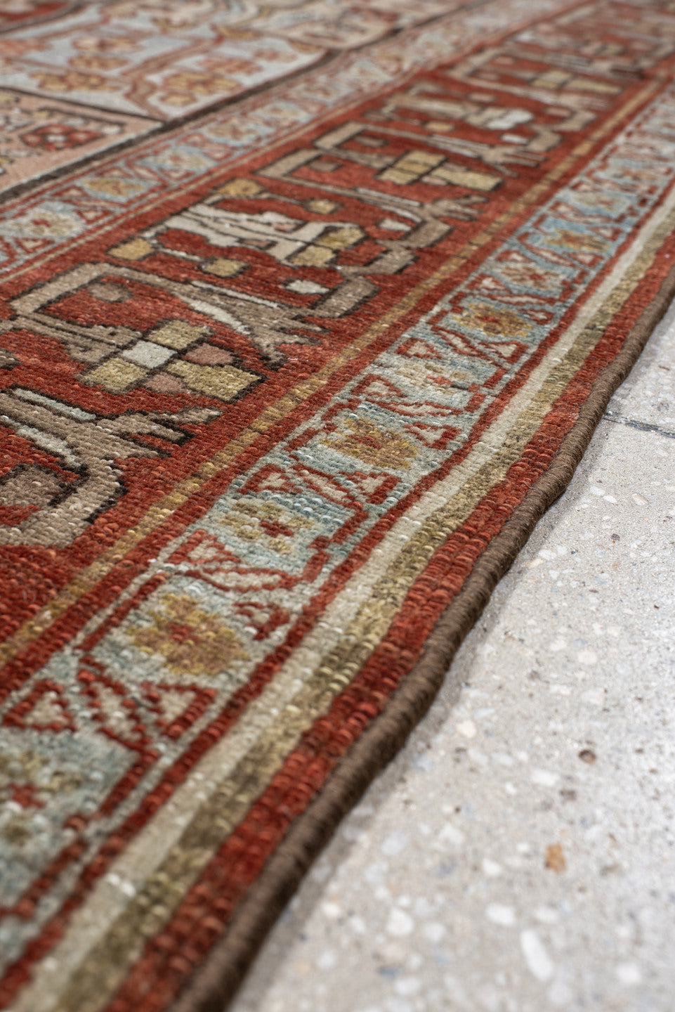 5' x 7' one-of-a-kind handmade antique Baktiary rug. Color palette: rust, ivory, brown, sky blue, sage, taupe, camel
