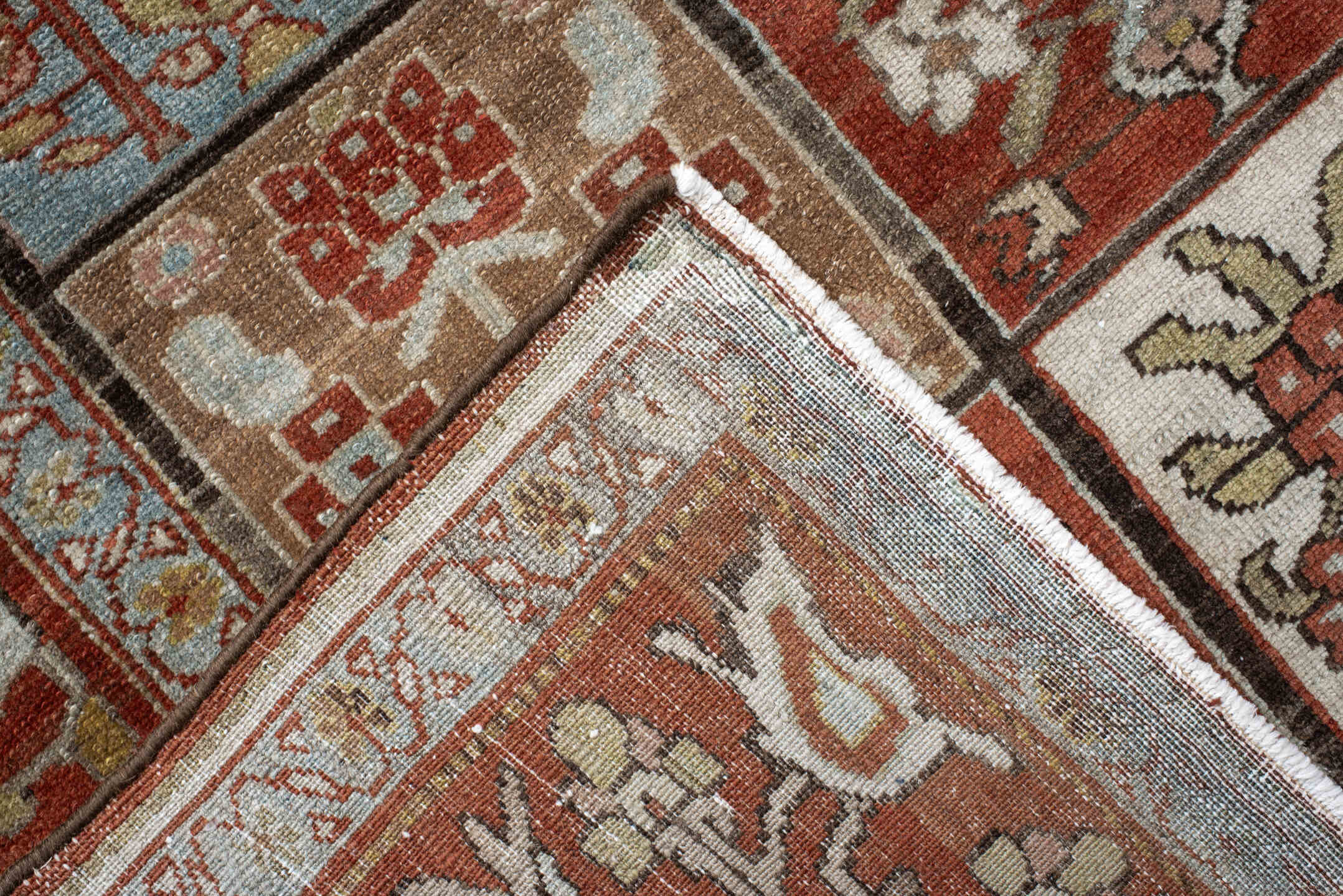 5' x 7' one-of-a-kind handmade antique Baktiary rug. Color palette: rust, ivory, brown, sky blue, sage, taupe, camel