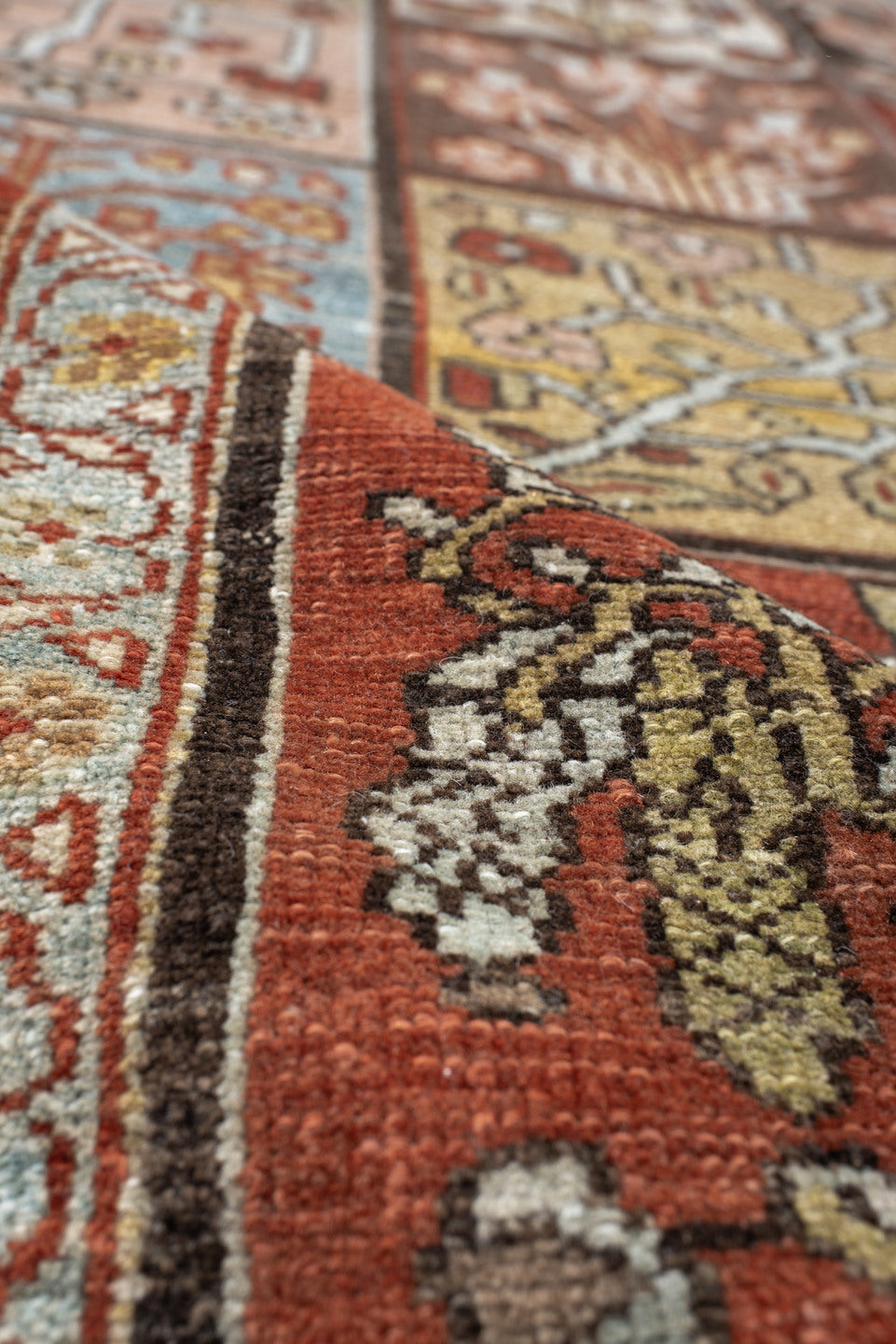 5' x 7' one-of-a-kind handmade antique Baktiary rug. Color palette: rust, ivory, brown, sky blue, sage, taupe, camel