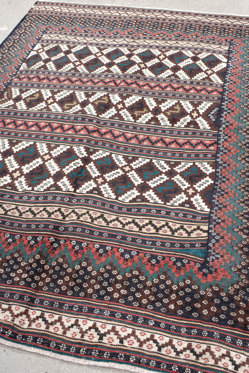 5' x 7' one-of-a-kind handmade vintage Kilim rug. Color palette: brown, ivory, rose, teal, charcoal, olive, pink, red, gray