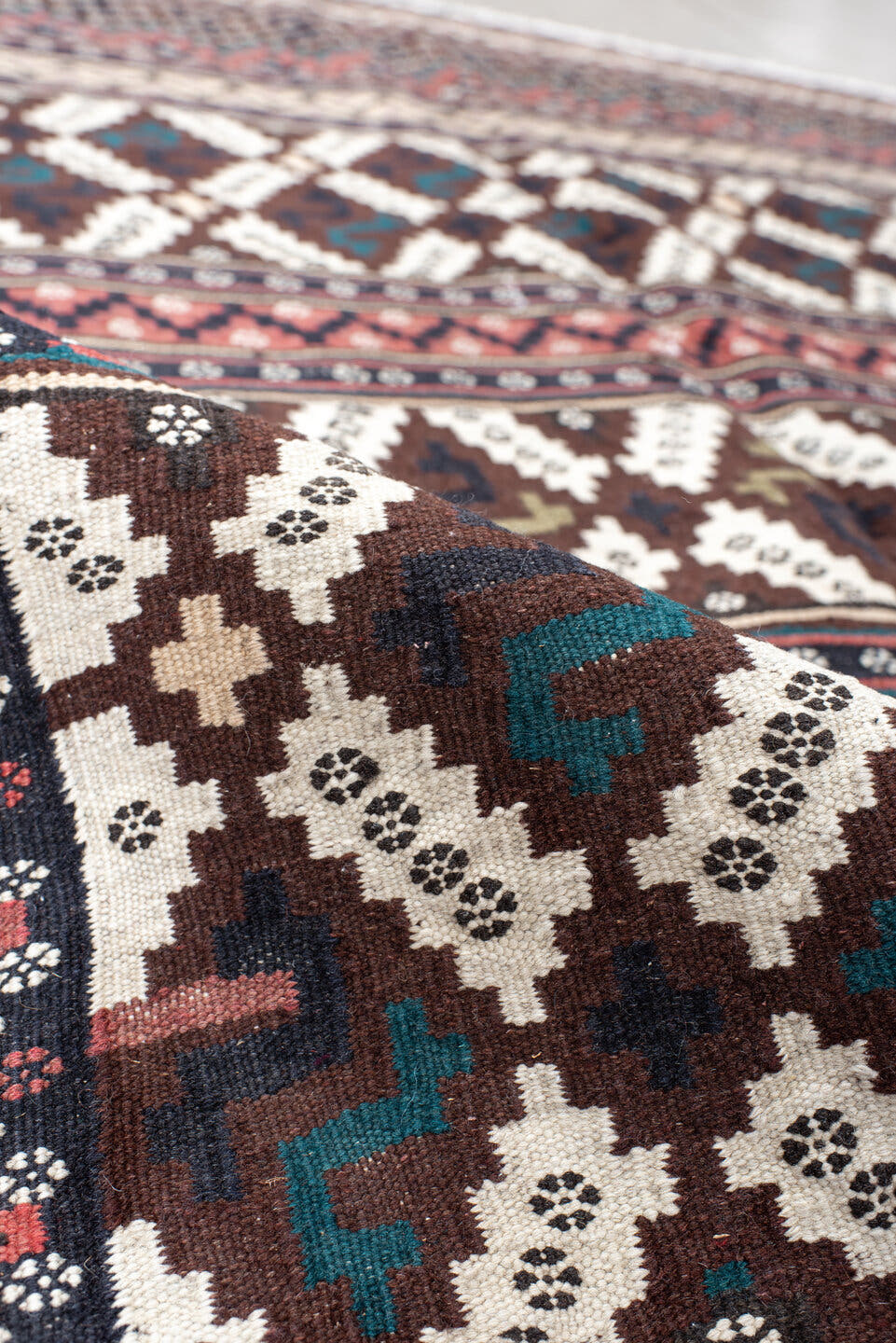 5' x 7' one-of-a-kind handmade vintage Kilim rug. Color palette: brown, ivory, rose, teal, charcoal, olive, pink, red, gray