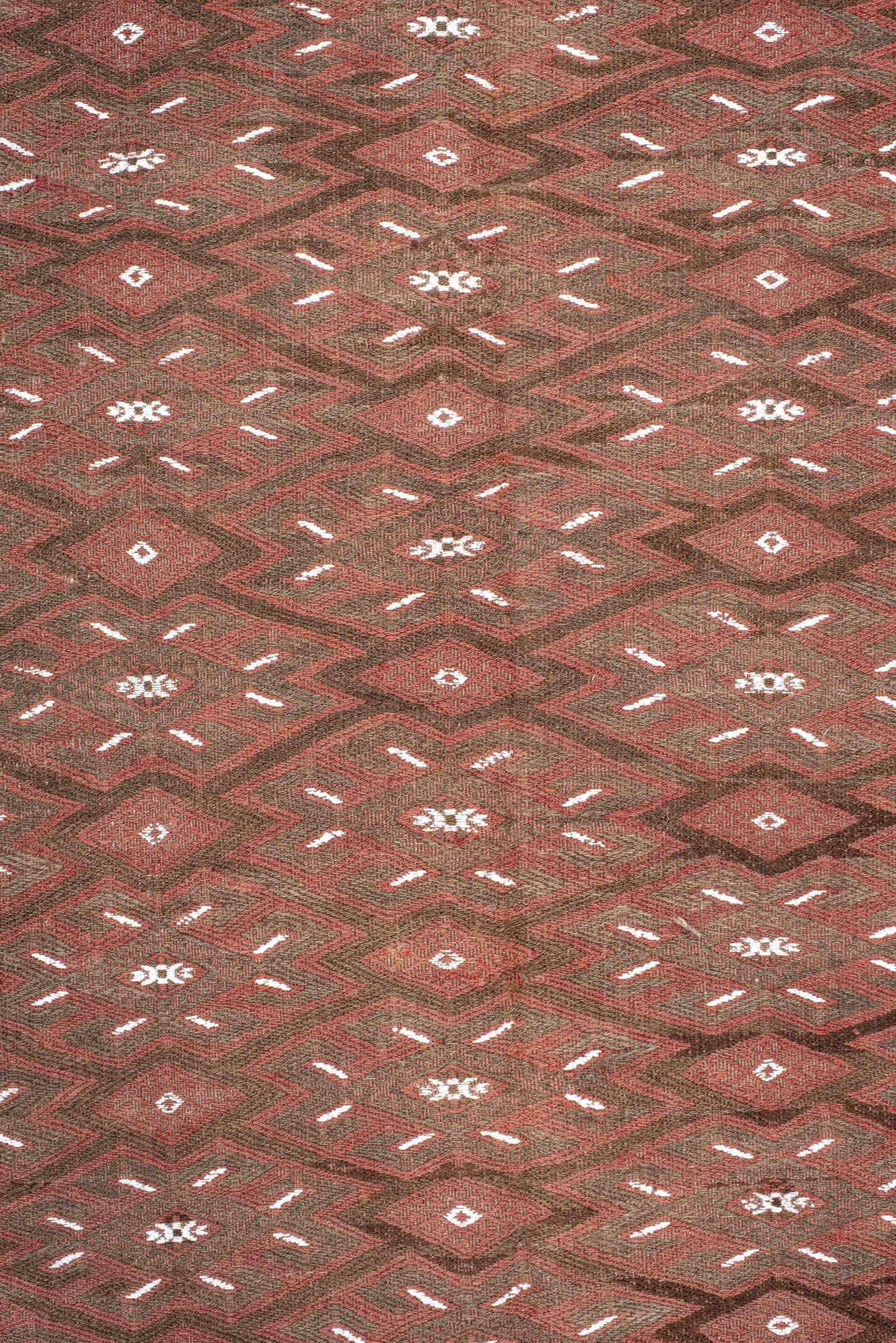 7' x 12' one-of-a-kind handmade antique Kilim large size rug. Color palette: rust, brown, ivory, terra cotta, taupe