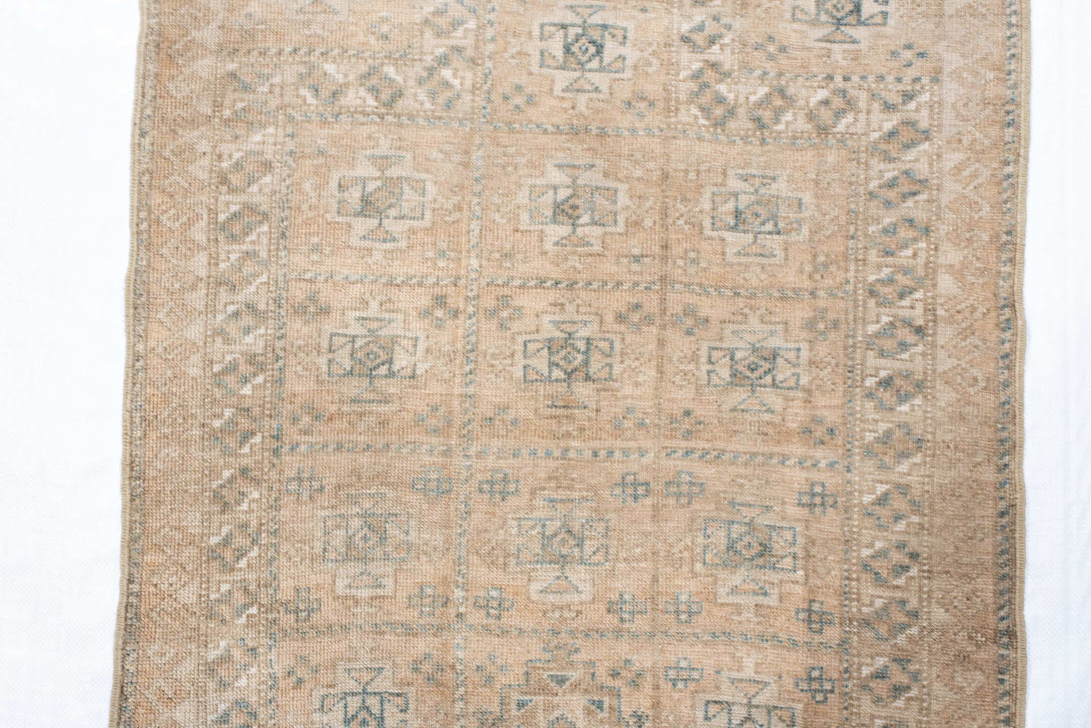 2' x 4' one-of-a-kind handmade vintage Belouch small size rug. Color palette: ivory, taupe, camel, pale blue, brown, sage