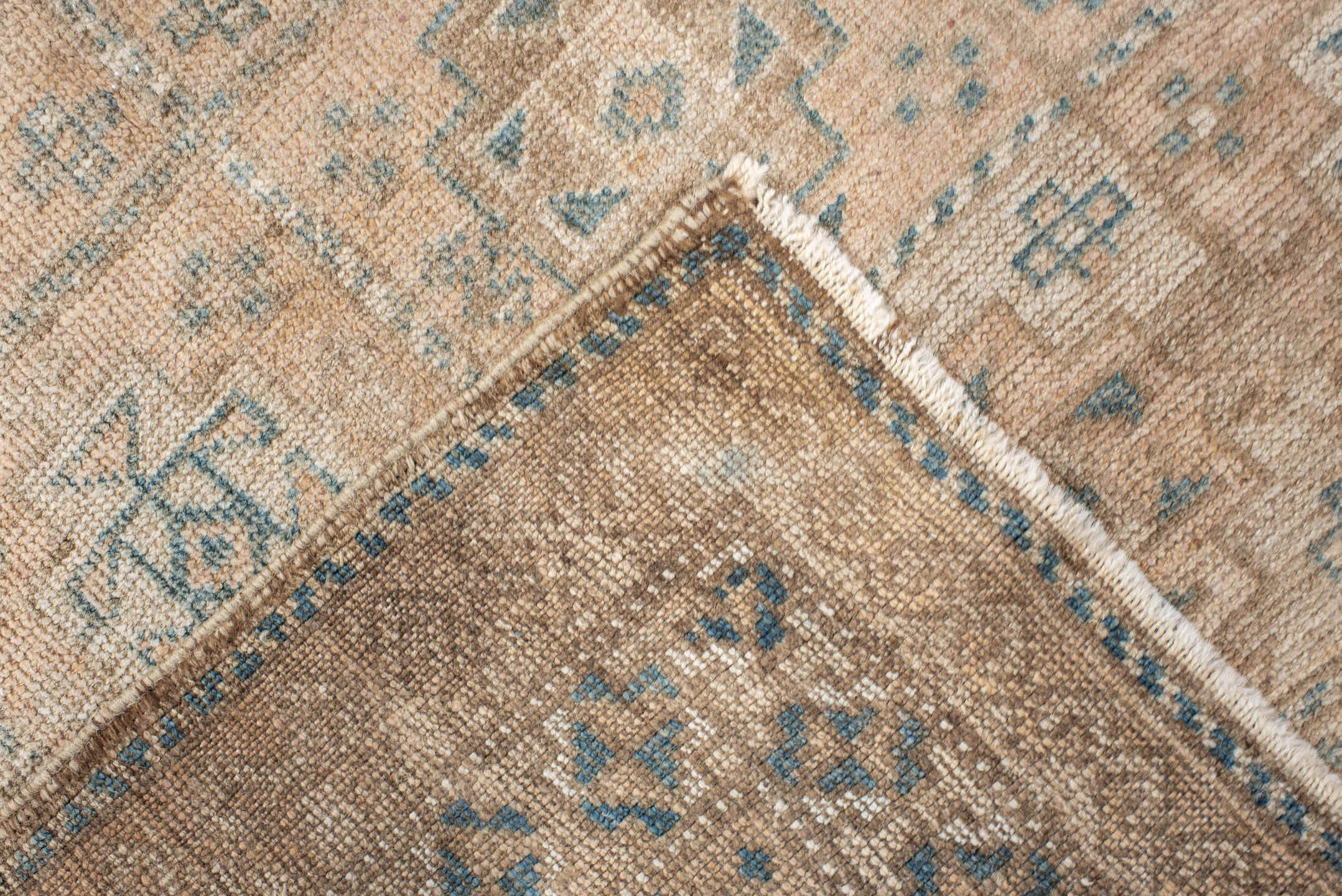 2' x 4' one-of-a-kind handmade vintage Belouch small size rug. Color palette: ivory, taupe, camel, pale blue, brown, sage
