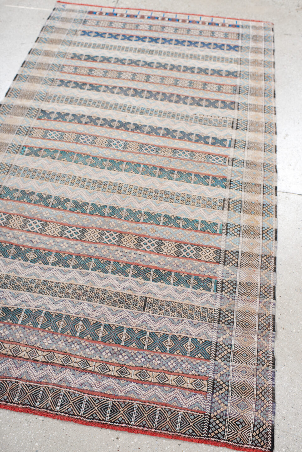 3' x 6' one-of-a-kind handmade vintage Moroccan small size rug. Color palette: ivory, indigo, sky blue, charcoal, rust