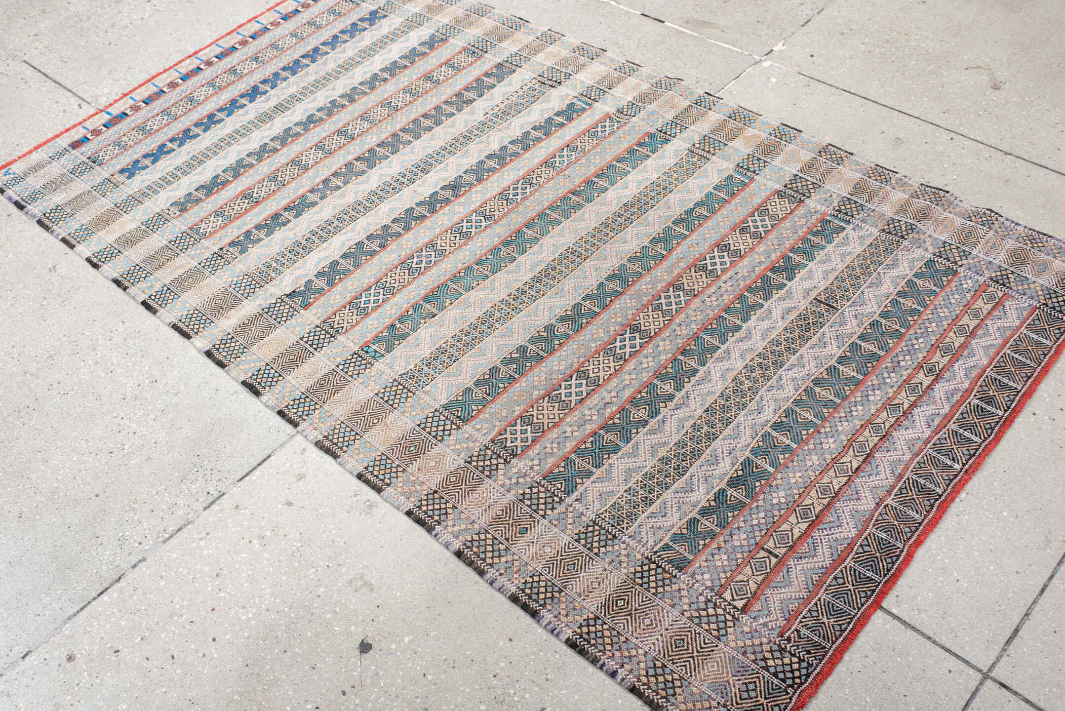 3' x 6' one-of-a-kind handmade vintage Moroccan small size rug. Color palette: ivory, indigo, sky blue, charcoal, rust