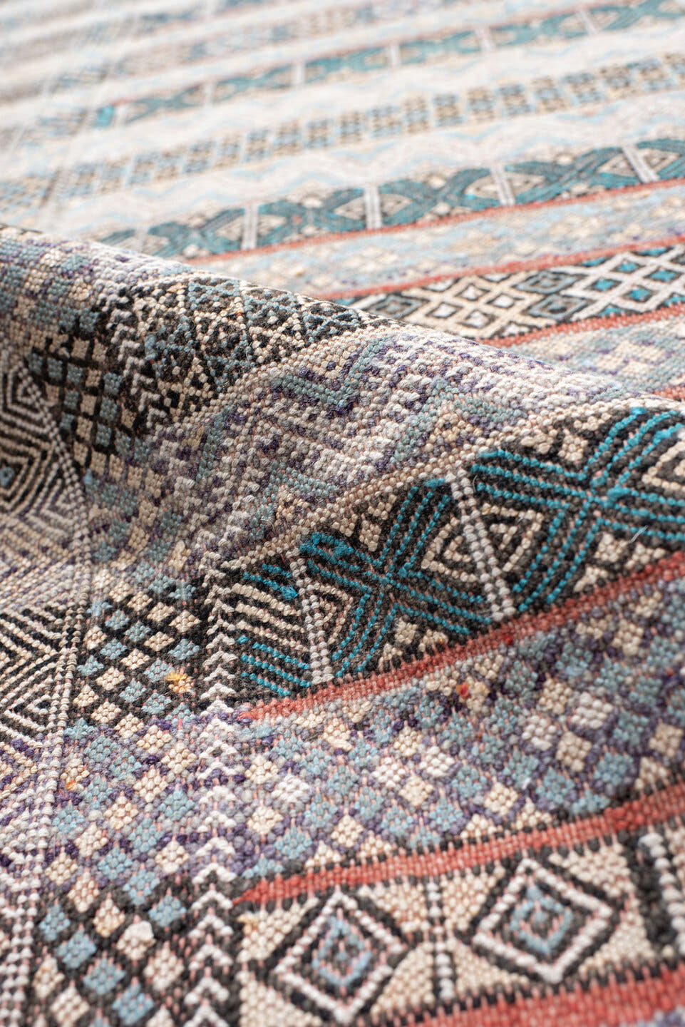 3' x 6' one-of-a-kind handmade vintage Moroccan small size rug. Color palette: ivory, indigo, sky blue, charcoal, rust