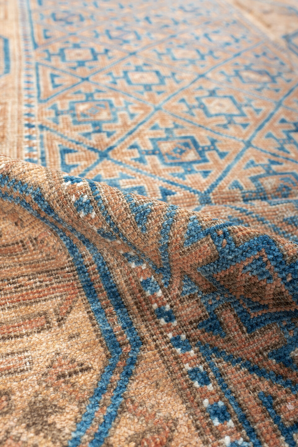 2' x 4' one-of-a-kind handmade antique Belouch small size rug. Color palette: peach, ivory, sky blue, camel, taupe