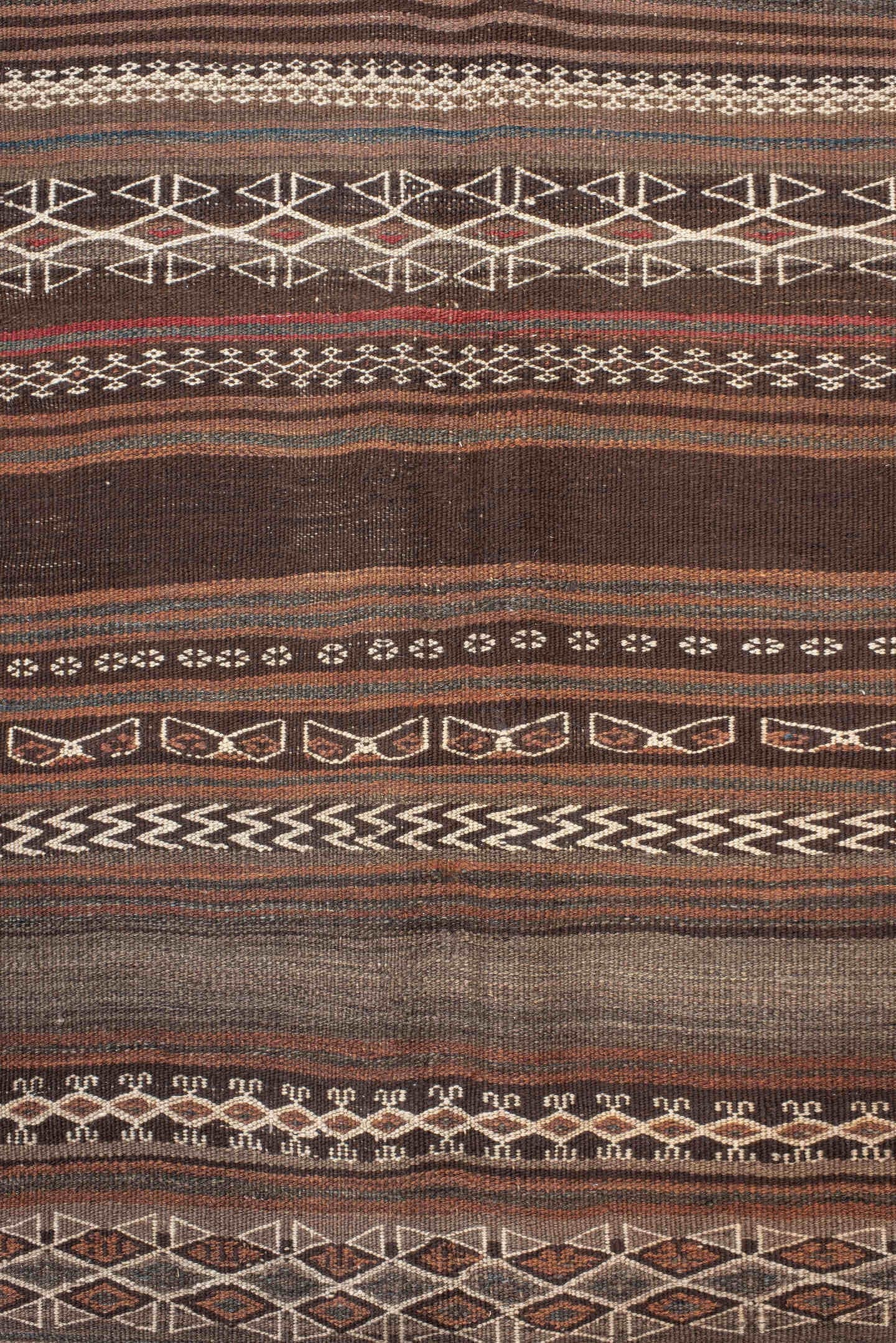4' x 12' one-of-a-kind handmade antique Kilim runner rug. Color palette: brown, taupe, charcoal, ivory, camel, slate, beige