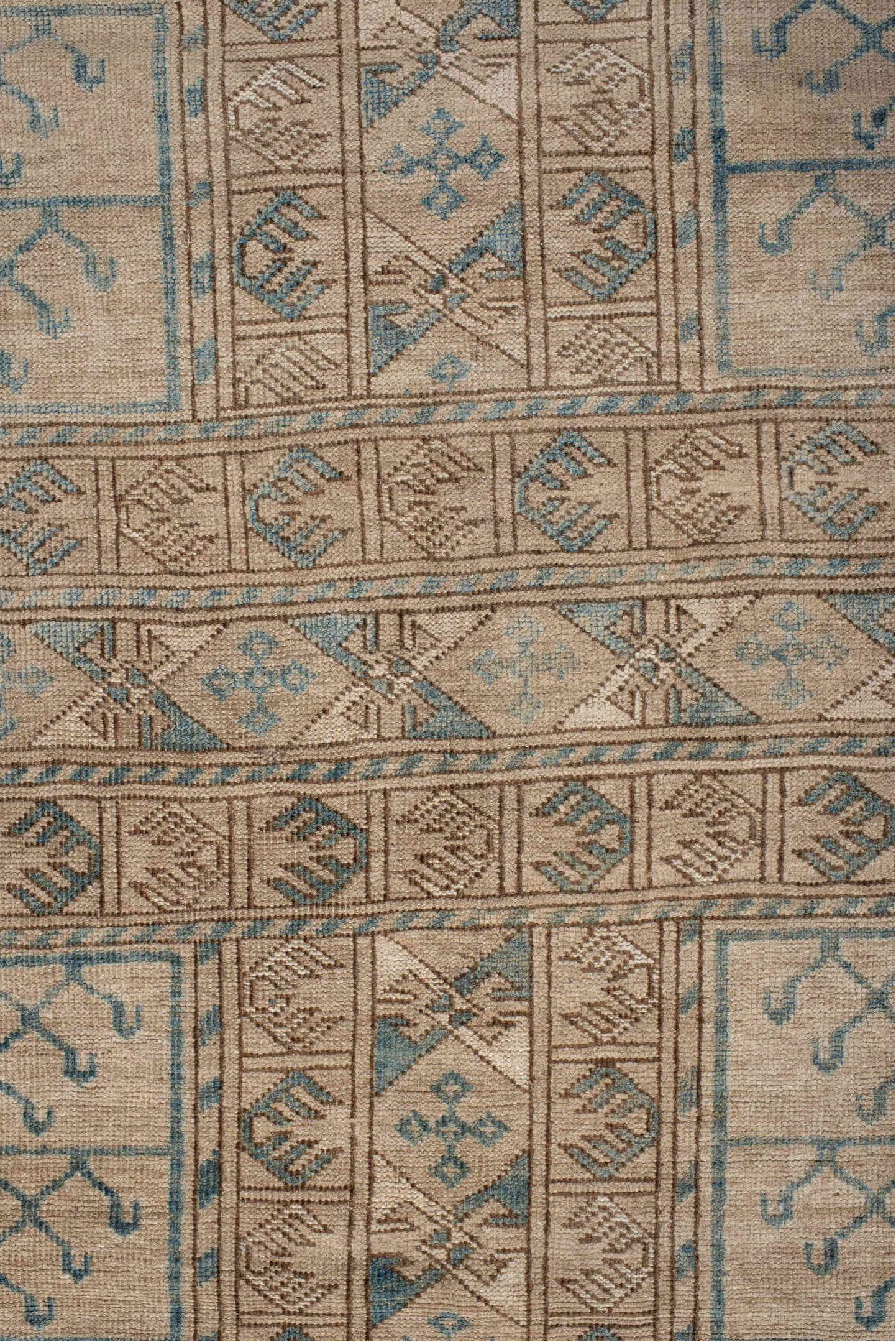 5' x 7' one-of-a-kind handmade antique Afghan rug. Color palette: ivory, taupe, teal, camel, beige, gray