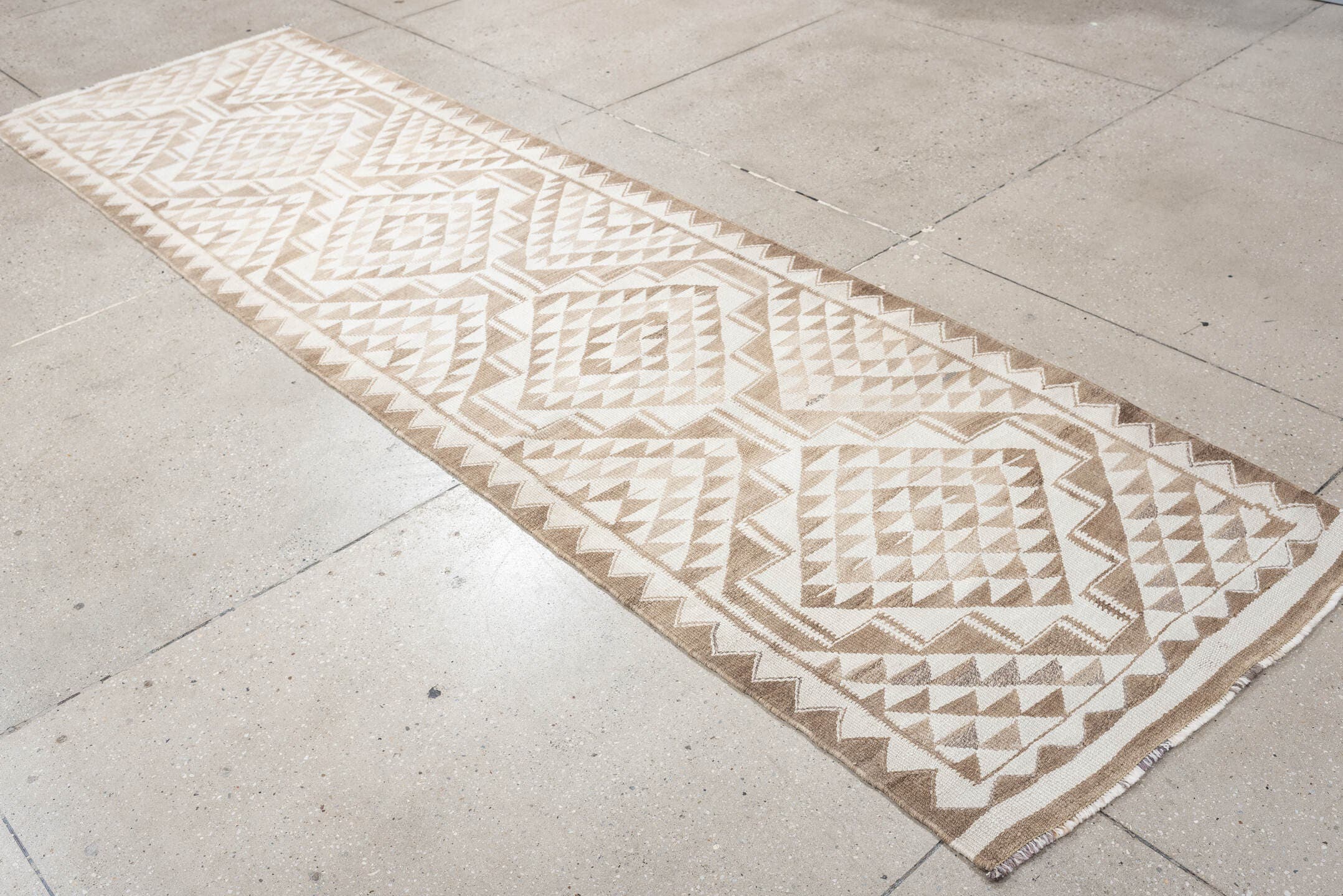 2' x 10' one-of-a-kind handmade antique Kilim runner rug. Color palette: ivory, taupe, beige, sand, gray