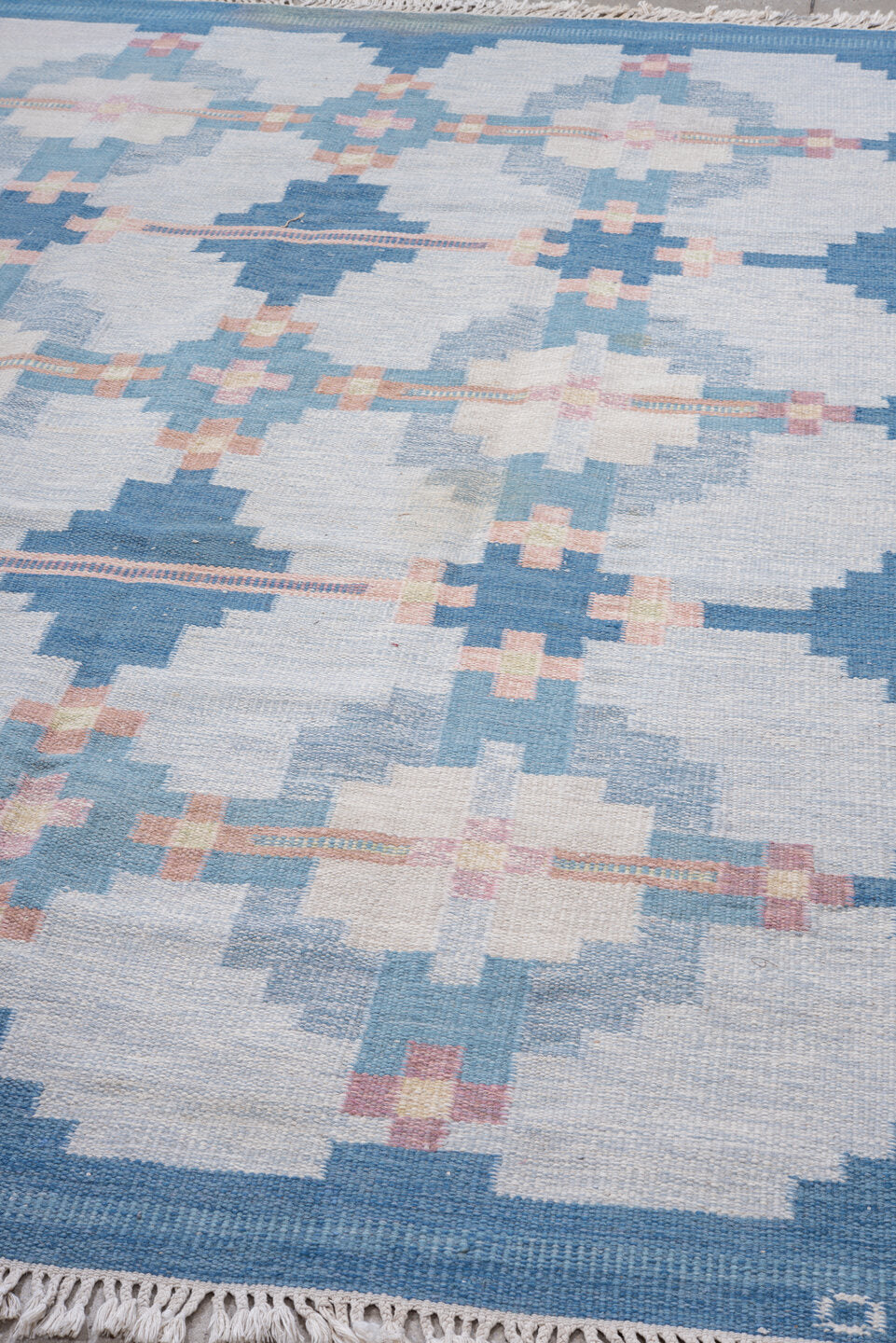 6' x 9' one-of-a-kind handmade vintage Rollaken medium size rug. Color palette: sky blue, ivory, pale blue, blush, cream