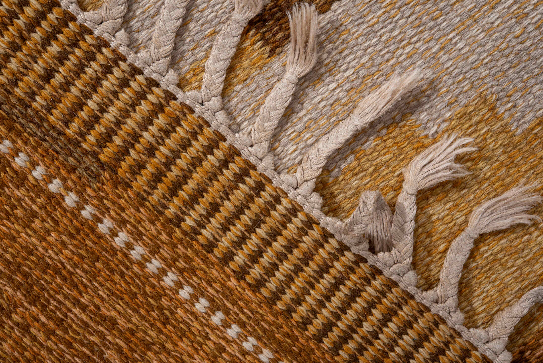 5' x 7' one-of-a-kind handmade antique Rollaken rug. Color palette: brown, camel, ivory, gold, mustard, gray, lavender