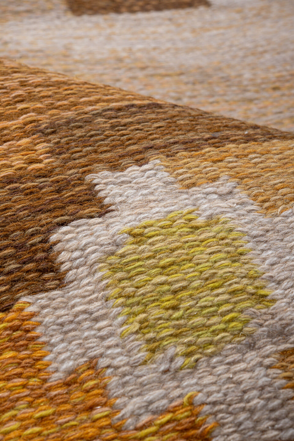 5' x 7' one-of-a-kind handmade antique Rollaken rug. Color palette: brown, camel, ivory, gold, mustard, gray, lavender