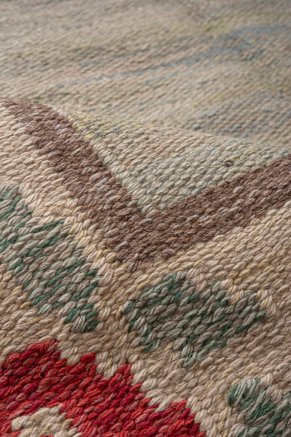 5' x 8' one-of-a-kind handmade vintage Rollaken medium size rug. Color palette: brown, gray, light gray, off-white, pink