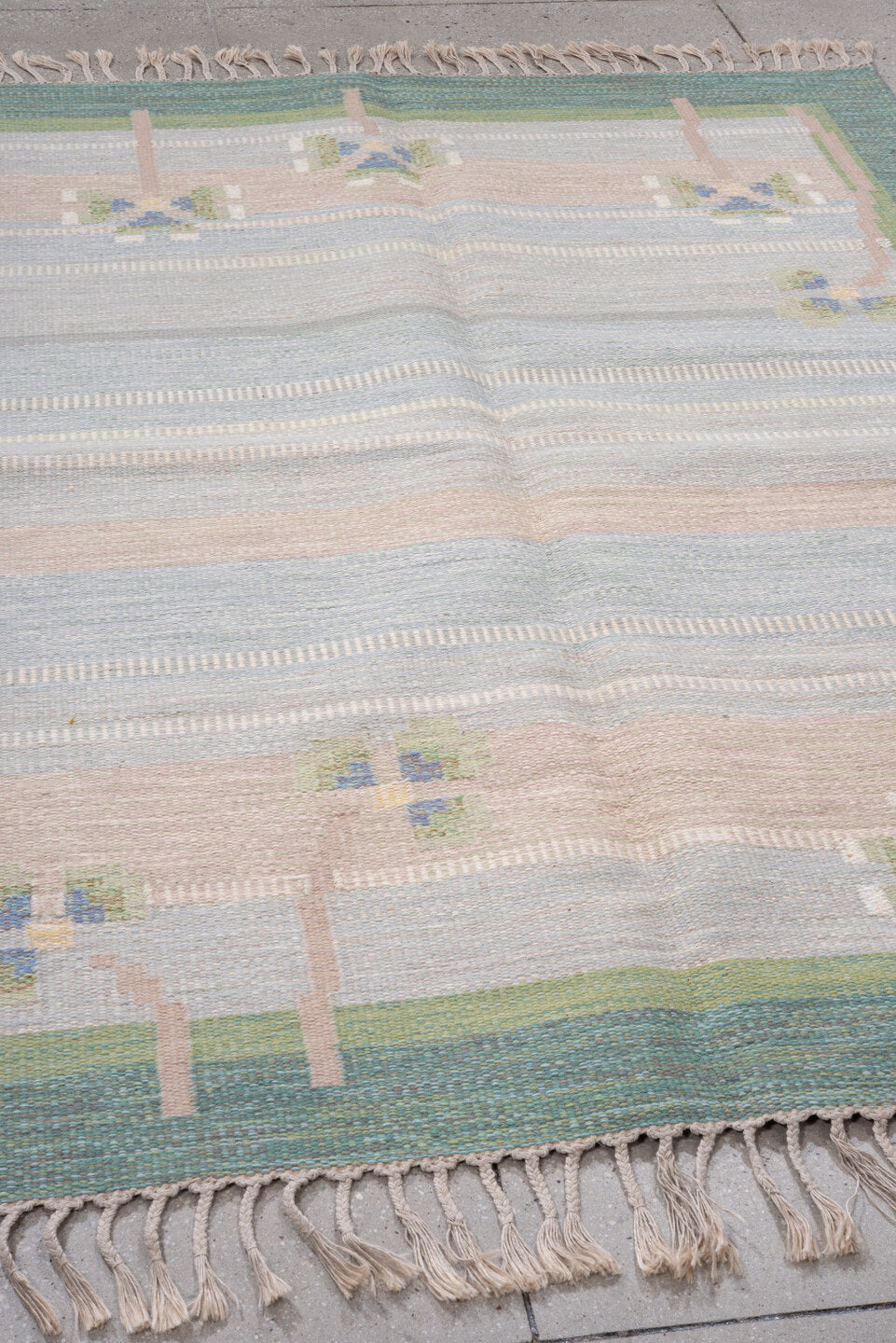 5' x 7' one-of-a-kind handmade antique Rollaken rug. Color palette: pale blue, seafoam, blush, ivory, sage, teal