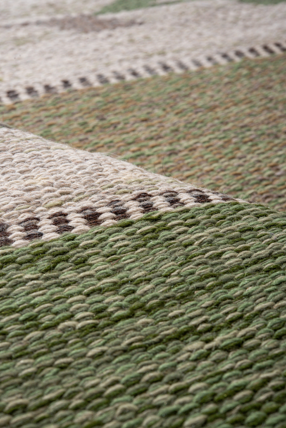 5' x 7' one-of-a-kind handmade antique Rollaken rug. Color palette: olive, ivory, sage, taupe, gold, gray, green, beige