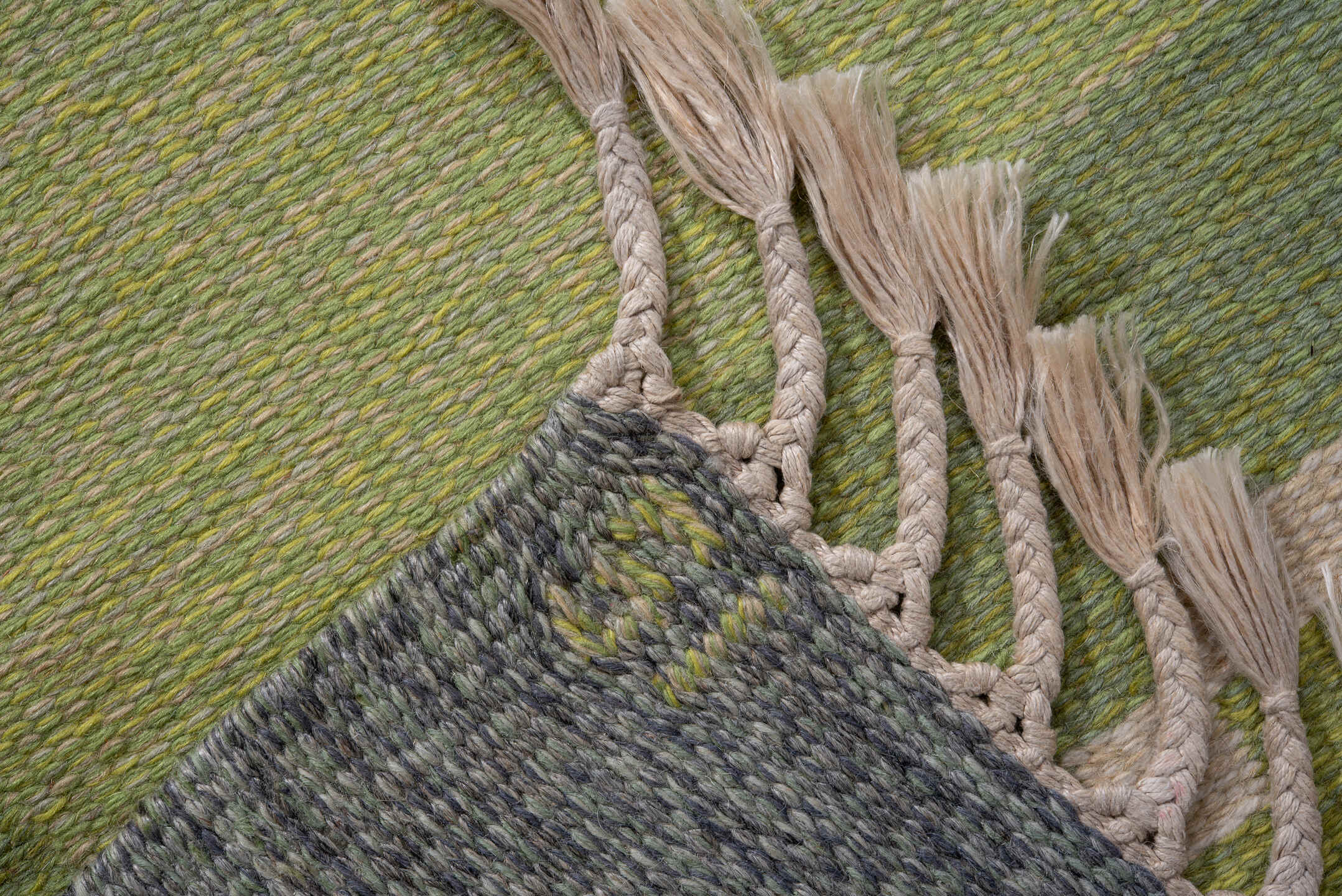 5' x 7' one-of-a-kind handmade vintage Rollaken rug. Color palette: dark khaki, dim gray, gray, green, light gray, off-white