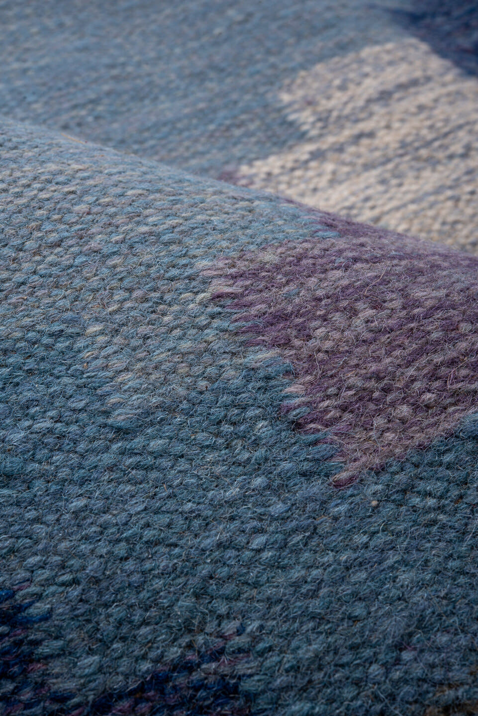 5' x 7' one-of-a-kind handmade antique Rollaken rug. Color palette: sky blue, cornflower blue, navy, ivory, lavender, slate