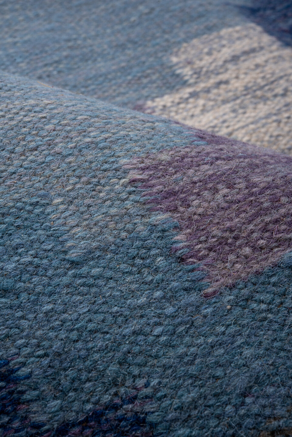 5' x 7' one-of-a-kind handmade antique Rollaken rug. Color palette: sky blue, cornflower blue, navy, ivory, lavender, slate