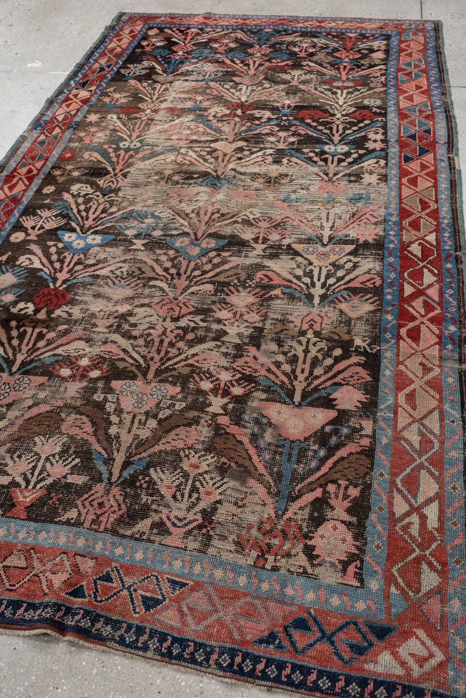 4' x 8' one-of-a-kind handmade vintage Karabagh rug. Color palette: arapawa, black, blue, brown, dark gray, gray, off-white