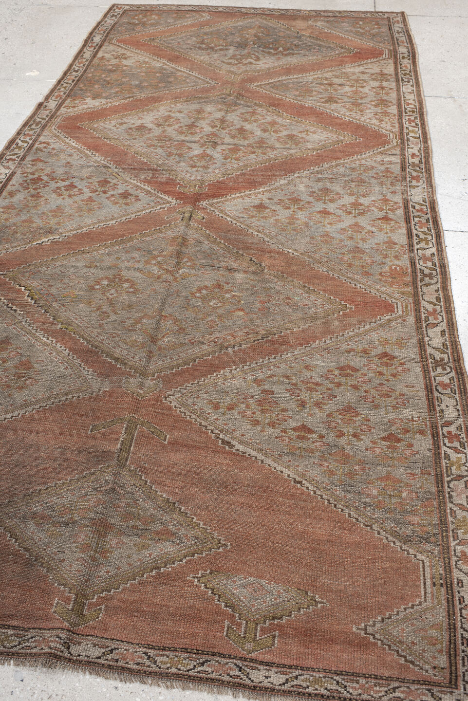 5' x 11' one-of-a-kind handmade antique NW Persian rug. Color palette: taupe, terra cotta, ivory, brown, sage, rust, beige