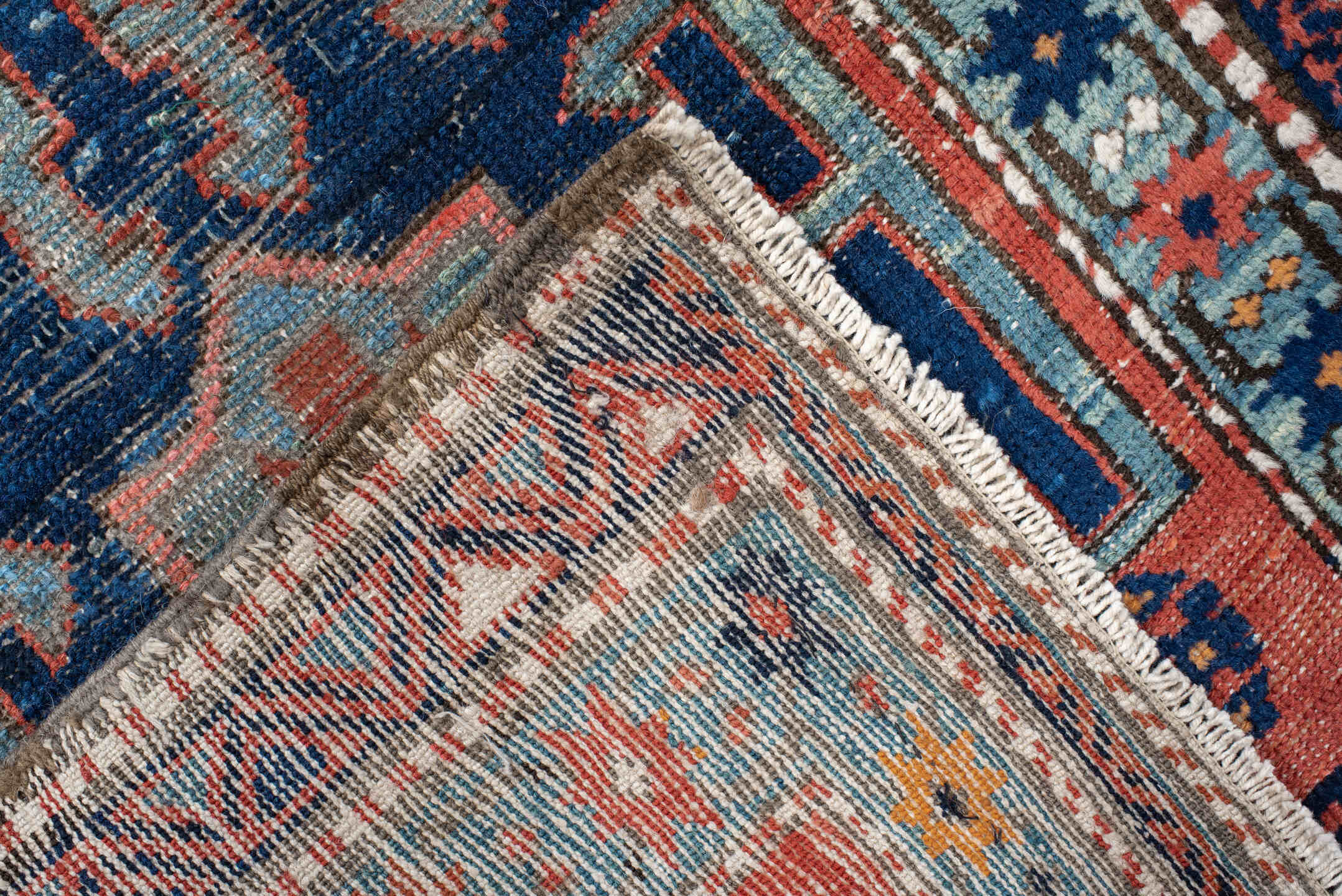 2' x 8' one-of-a-kind handmade vintage Heriz runner rug. Color palette: rust, navy, sky blue, ivory, camel, coral, charcoal