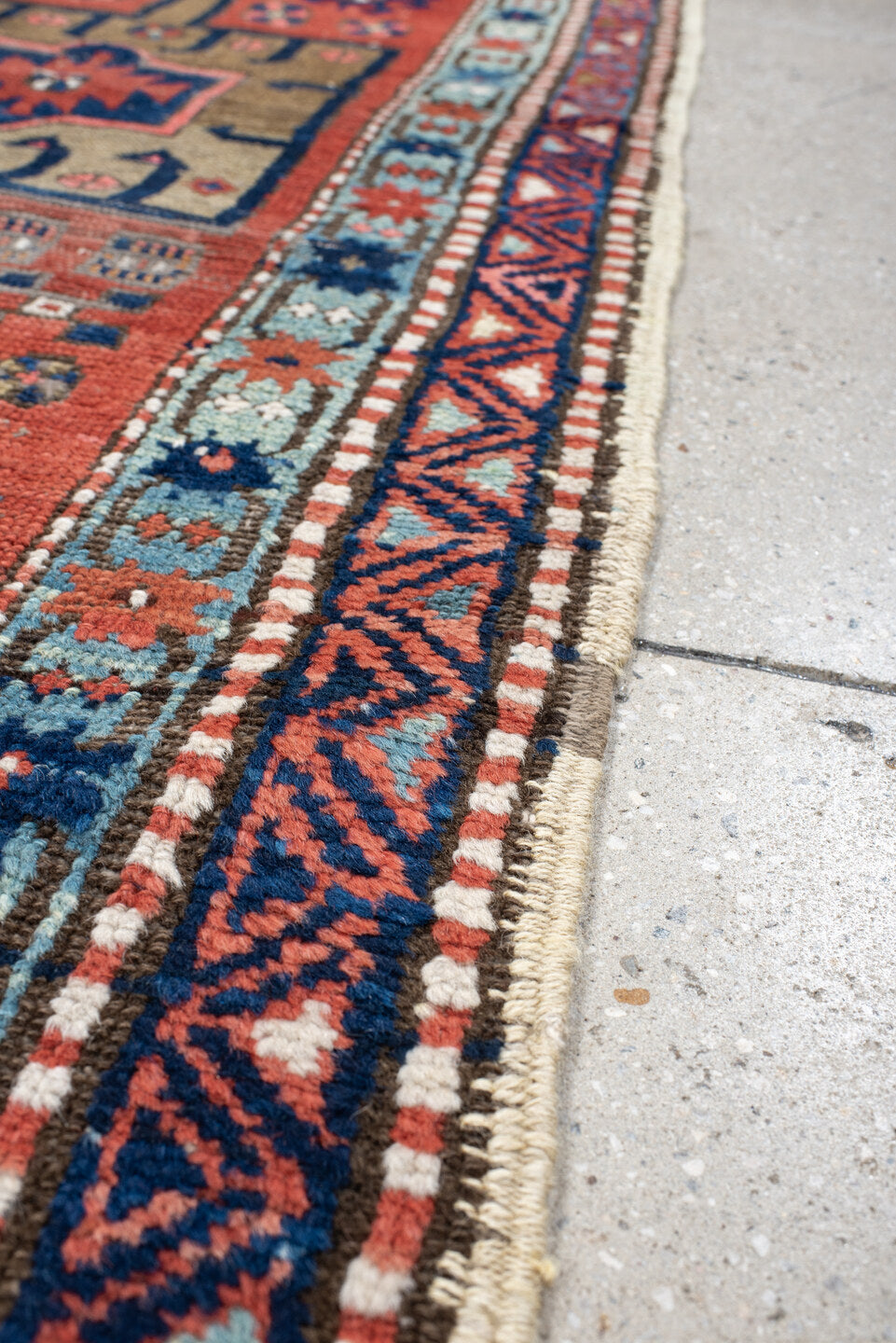 2' x 8' one-of-a-kind handmade vintage Heriz runner rug. Color palette: rust, navy, sky blue, ivory, camel, coral, charcoal