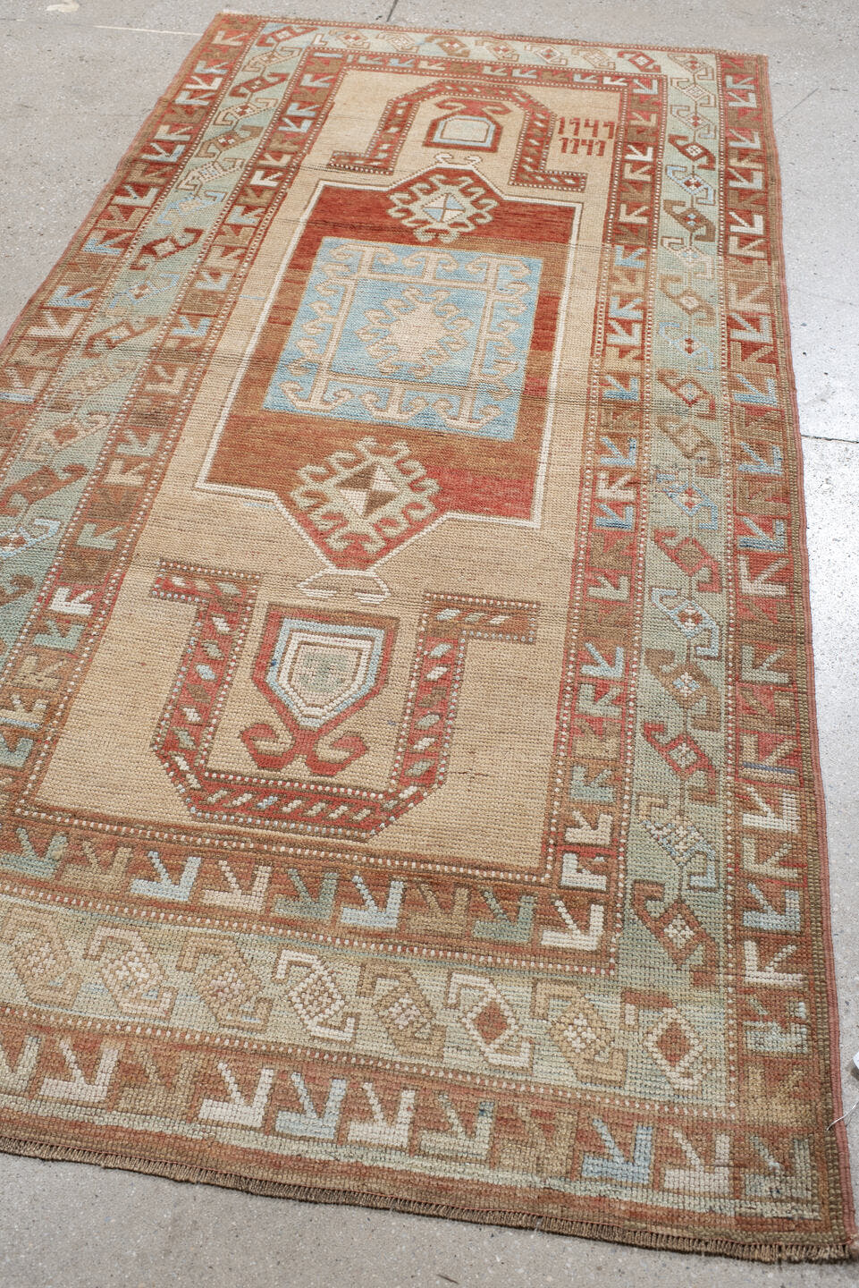 3' x 6' one-of-a-kind handmade vintage Caucasian small size rug. Color palette: ivory, rust, sky blue, camel, taupe