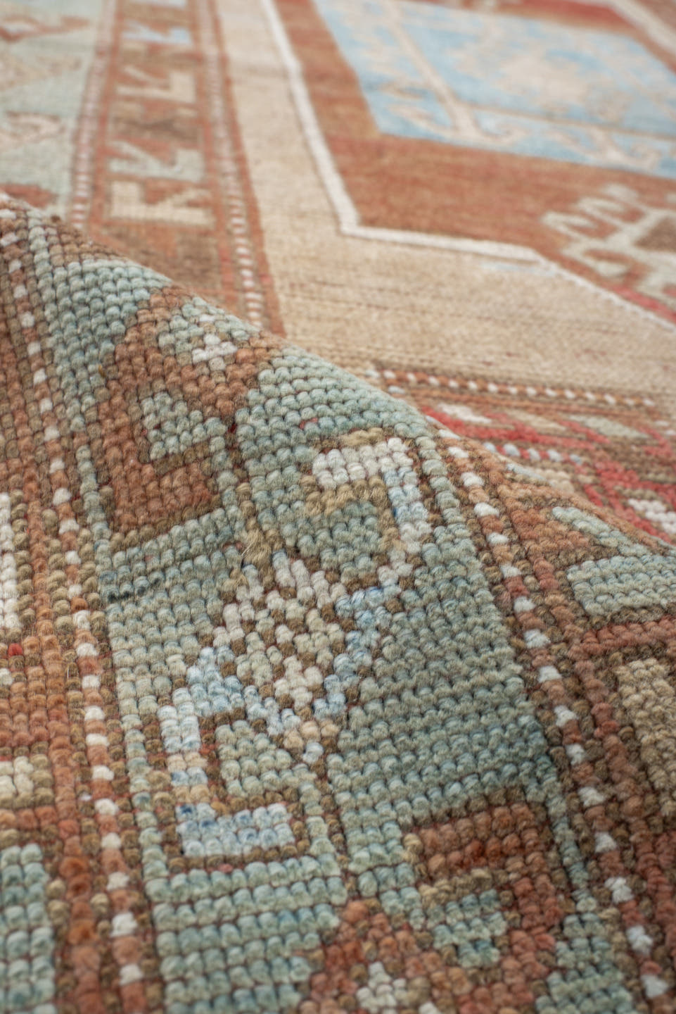 3' x 6' one-of-a-kind handmade vintage Caucasian small size rug. Color palette: ivory, rust, sky blue, camel, taupe