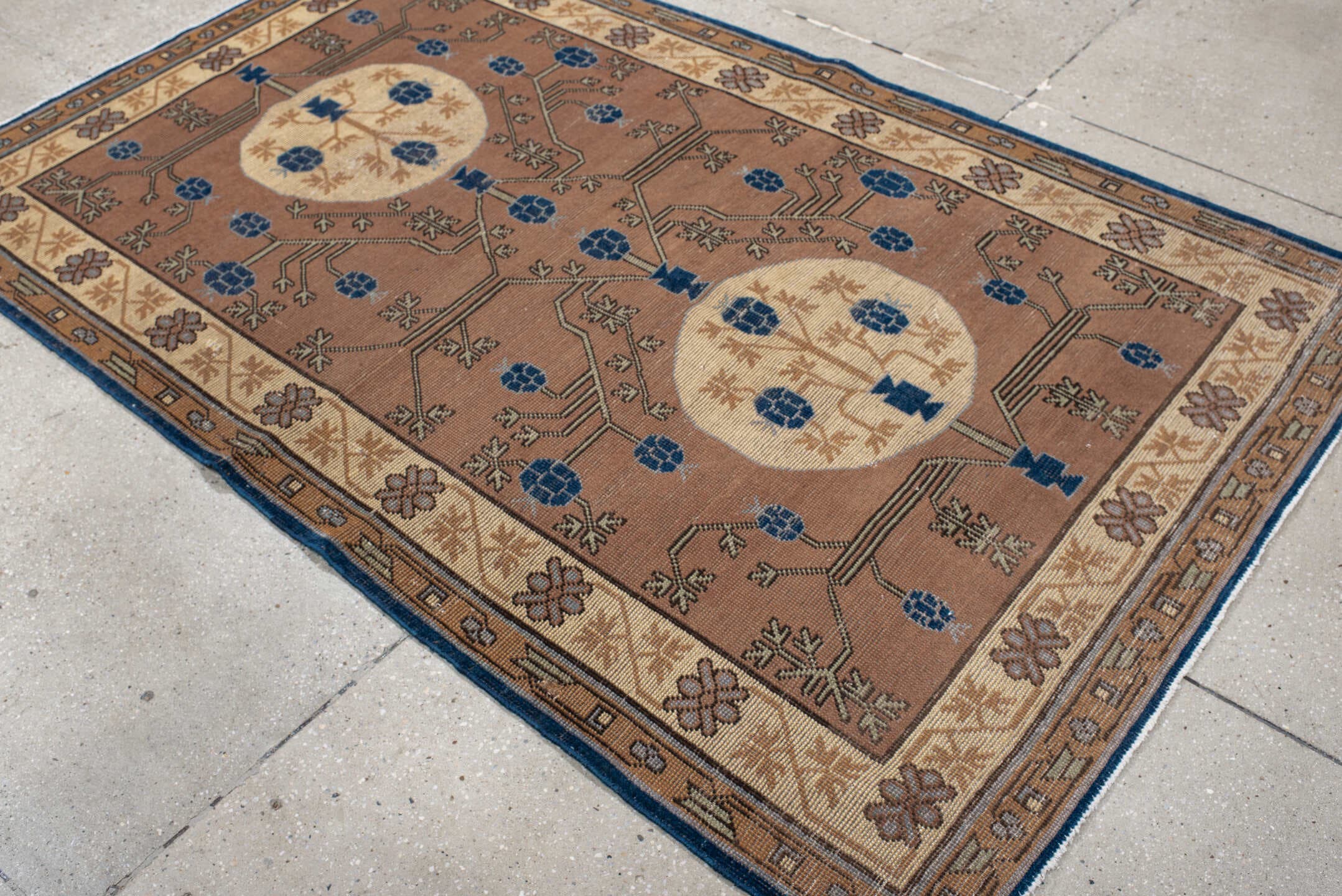 4' x 6' one-of-a-kind handmade vintage Khotan small size rug. Color palette: camel, ivory, indigo, taupe, brown, slate