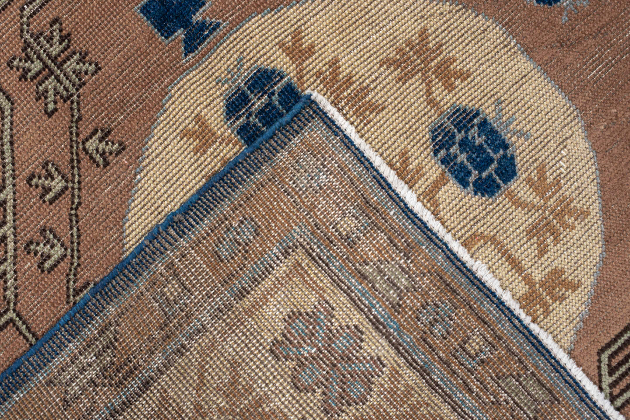 4' x 6' one-of-a-kind handmade vintage Khotan small size rug. Color palette: camel, ivory, indigo, taupe, brown, slate