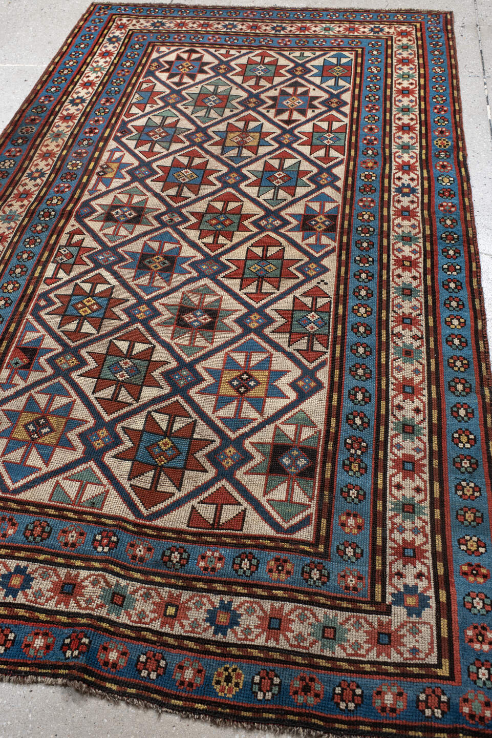 3' x 6' one-of-a-kind handmade vintage Kazak small size rug. Color palette: antiquewhite, arapawa, bisque, black