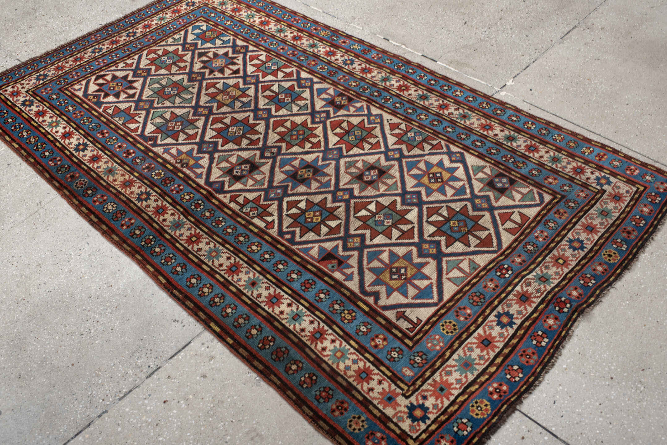 3' x 6' one-of-a-kind handmade vintage Kazak small size rug. Color palette: antiquewhite, arapawa, bisque, black