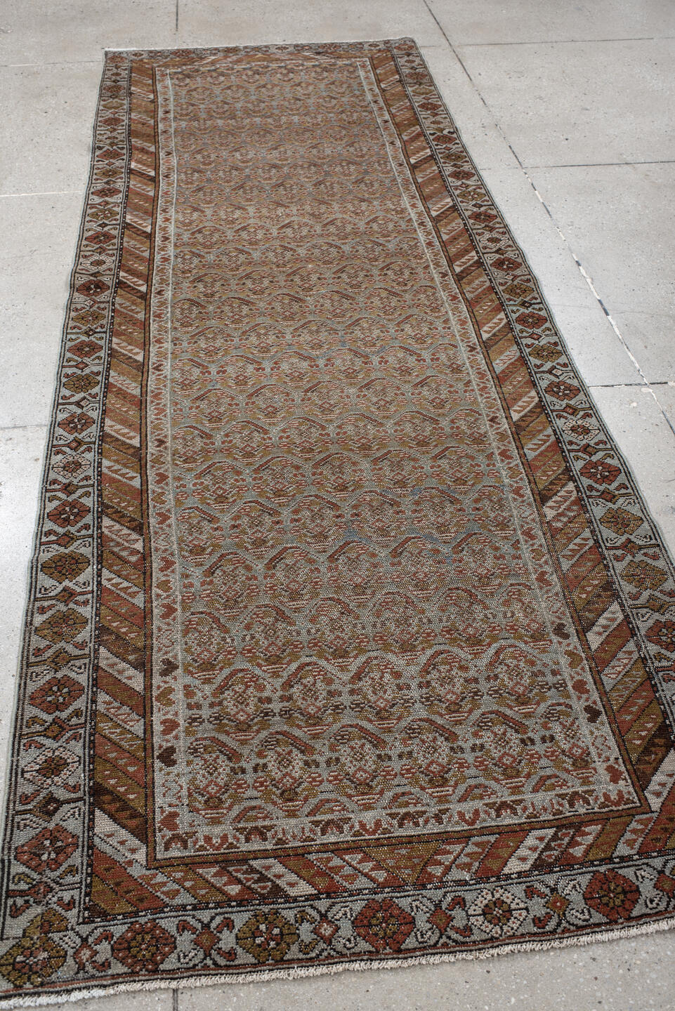 3' x 10' one-of-a-kind handmade vintage Malayer runner rug. Color palette: taupe, rust, ivory, muted blue, camel, brown