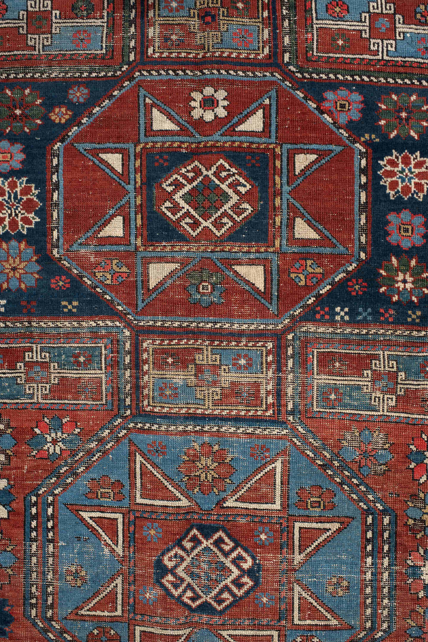 4' x 8' one-of-a-kind handmade vintage Shirvan rug. Color palette: rust, navy, sky blue, ivory, terra cotta, slate, cream