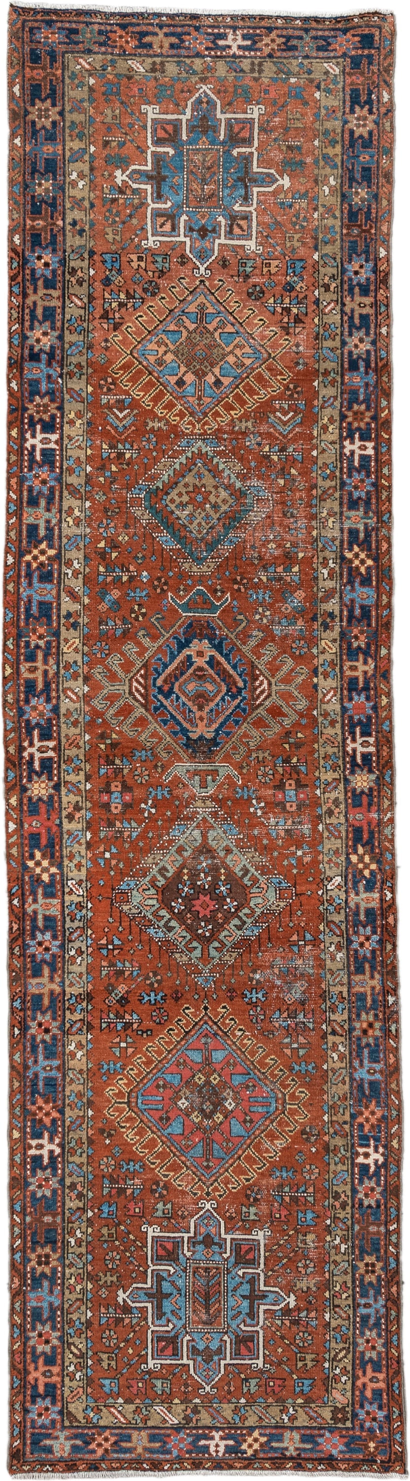 3' x 11' one-of-a-kind handmade vintage Karaje runner rug. Color palette: rust, indigo, sky_blue, ivory, camel, slate, rose