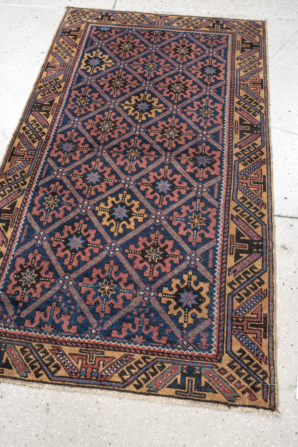 2' x 4' one-of-a-kind handmade vintage Belouch small size rug. Color palette: navy, camel, rust, indigo, gold, rose, ivory