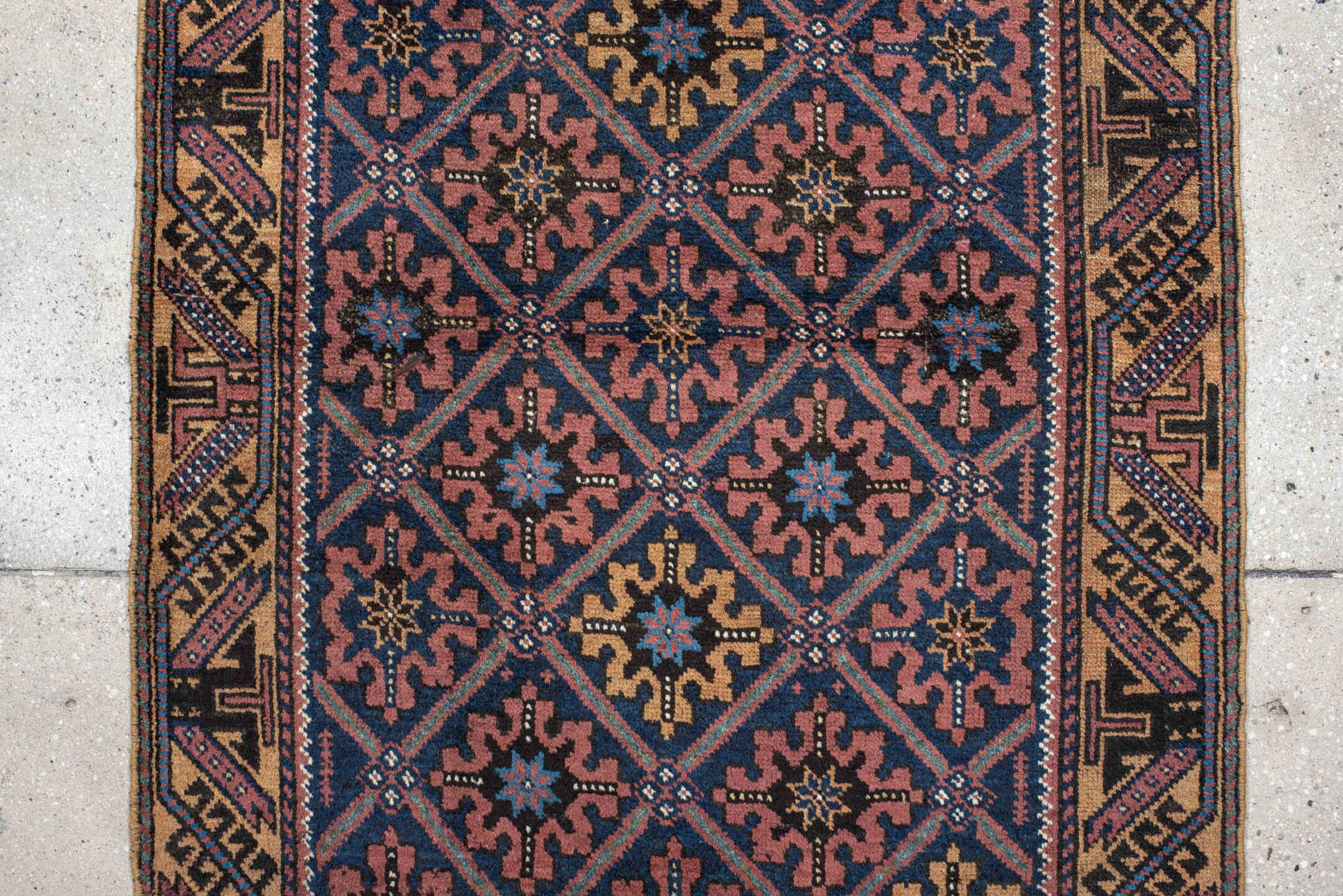 2' x 4' one-of-a-kind handmade vintage Belouch small size rug. Color palette: navy, camel, rust, indigo, gold, rose, ivory