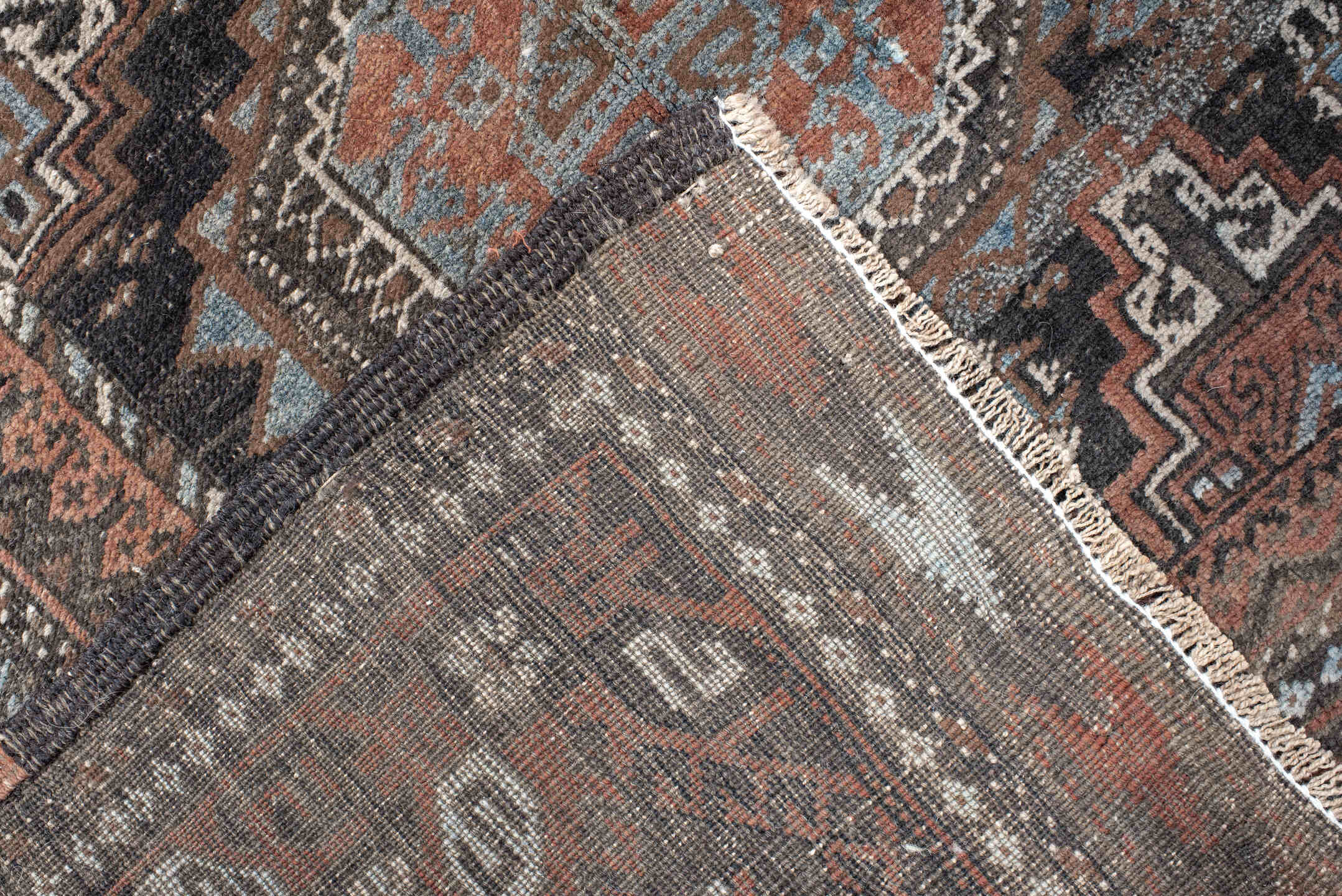 3' x 5' one-of-a-kind handmade antique Belouch small size rug. Color palette: brown, charcoal, rust, sky blue, ivory, taupe
