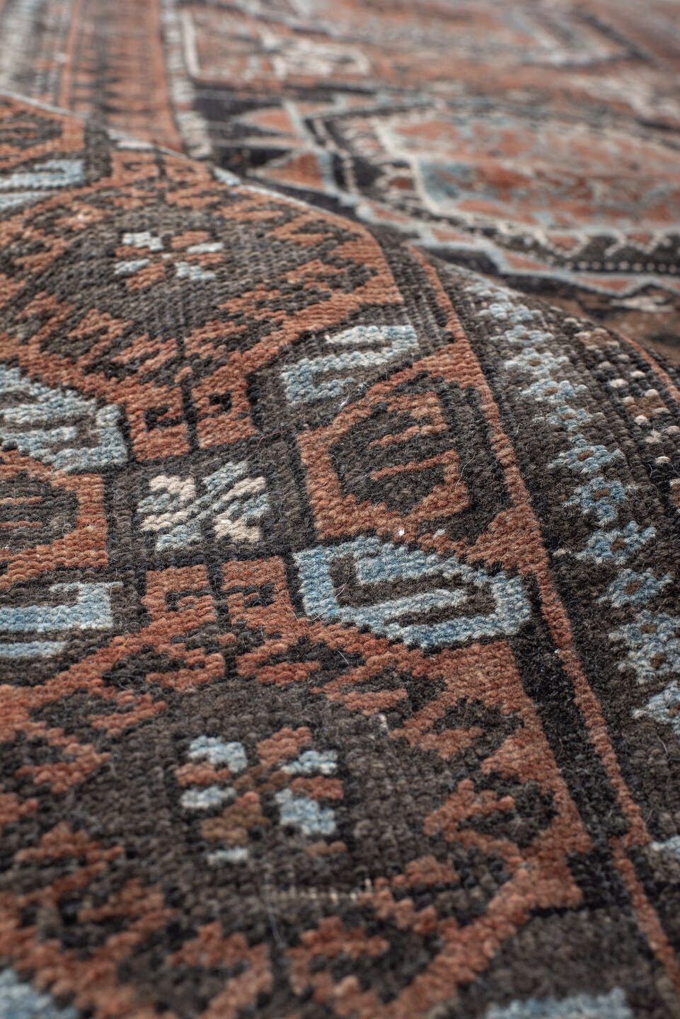 3' x 5' one-of-a-kind handmade antique Belouch small size rug. Color palette: brown, charcoal, rust, sky blue, ivory, taupe