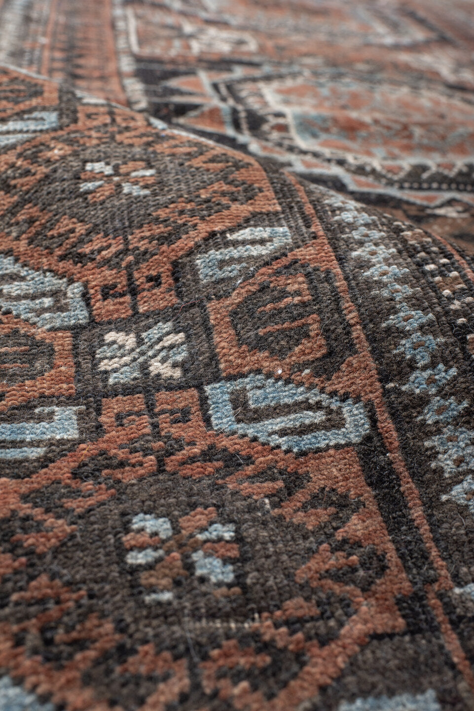 3' x 5' one-of-a-kind handmade antique Belouch small size rug. Color palette: brown, charcoal, rust, sky blue, ivory, taupe
