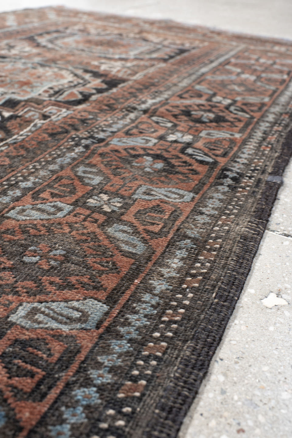 3' x 5' one-of-a-kind handmade antique Belouch small size rug. Color palette: brown, charcoal, rust, sky blue, ivory, taupe