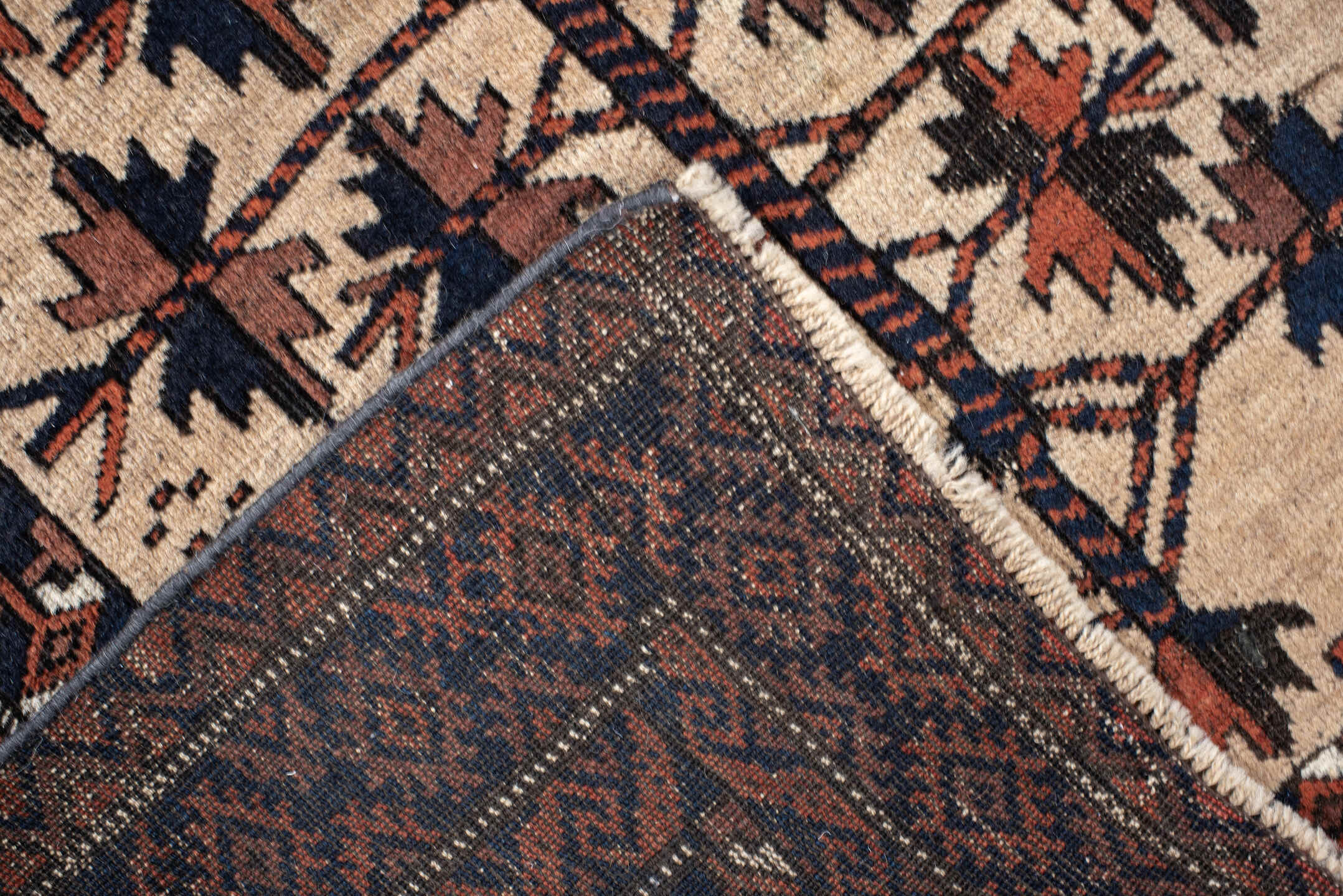 2' x 4' one-of-a-kind handmade vintage Belouch small size rug. Color palette: ivory, rust, navy, camel, brown, terracotta